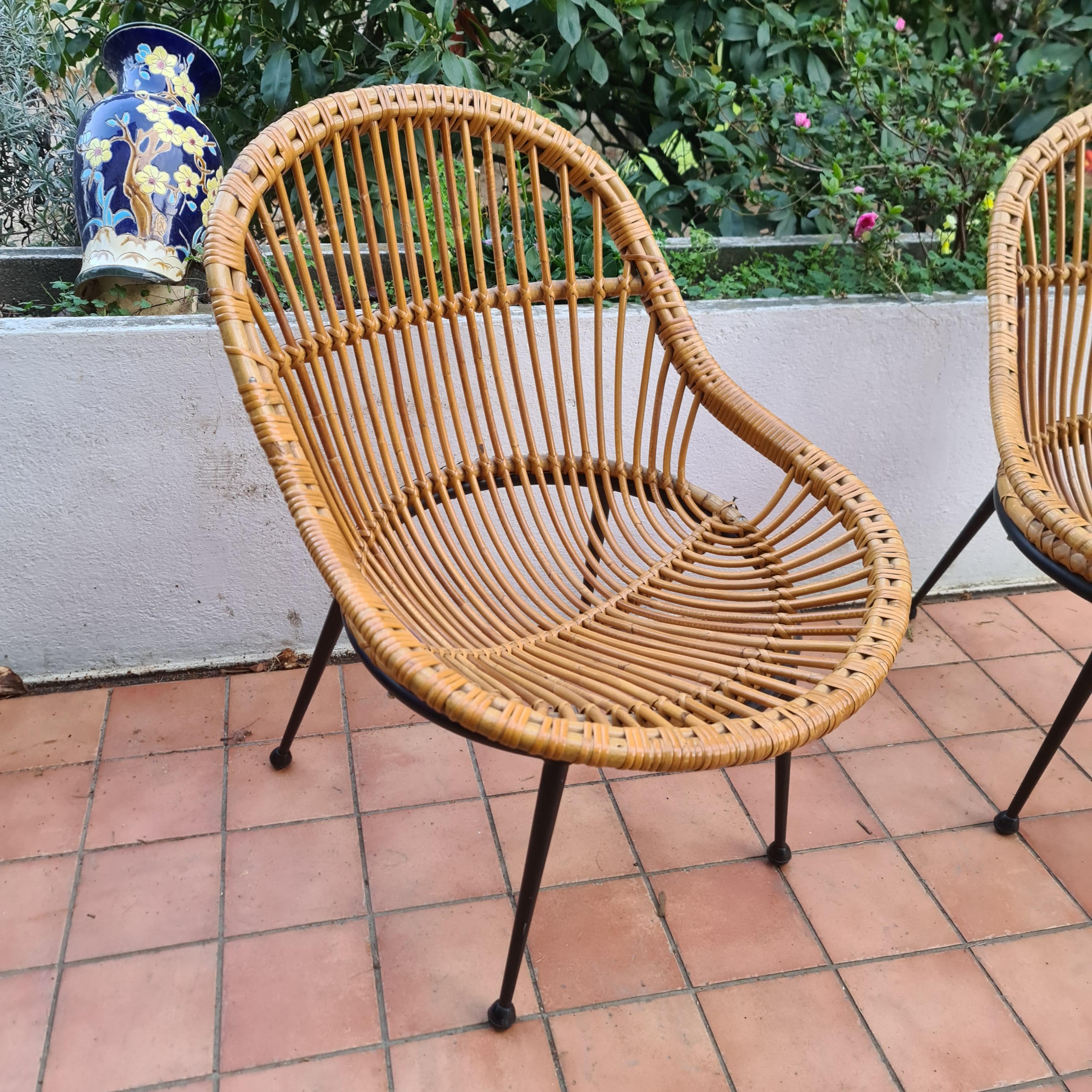 Italian pair of wicker armchairs and black lacquered metal foot Italy circa 1960 For Sale