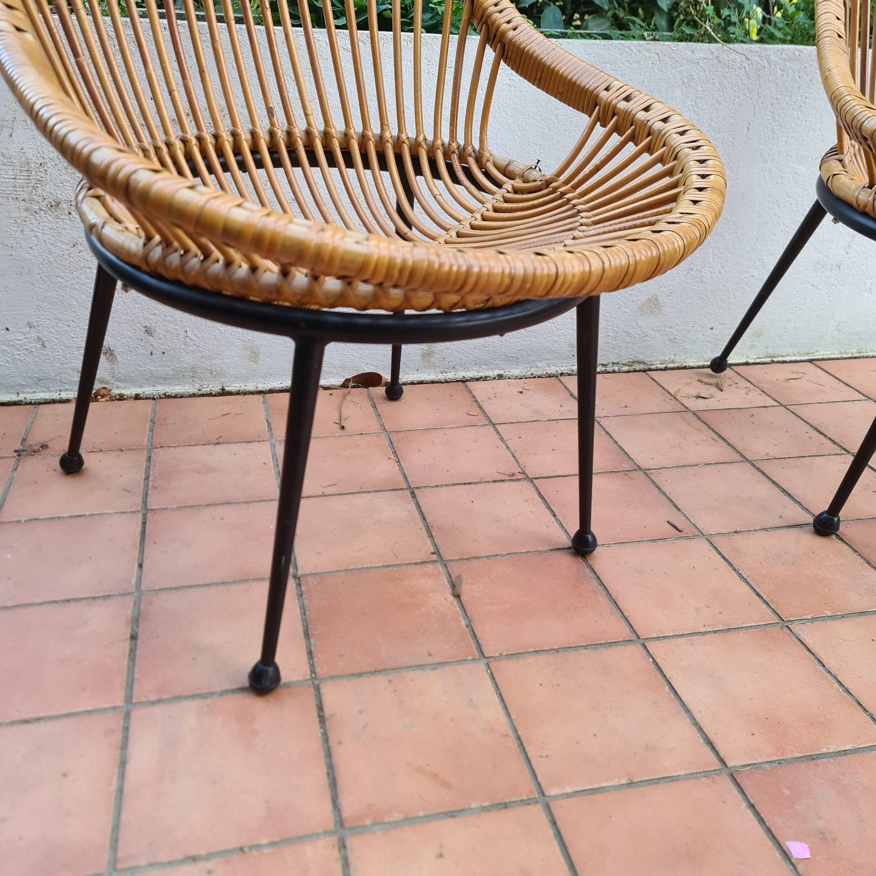 pair of wicker armchairs and black lacquered metal foot Italy circa 1960 For Sale 1