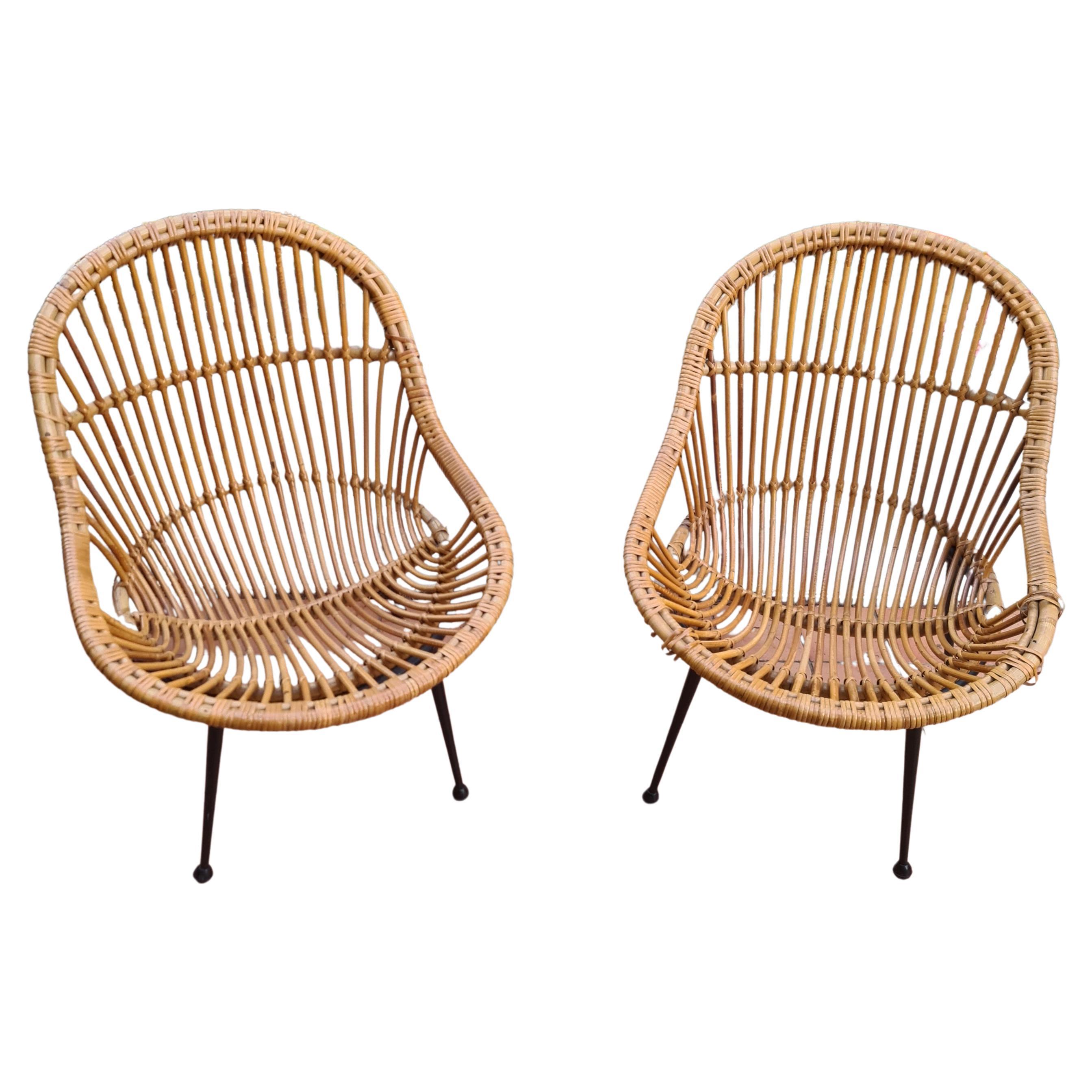 pair of wicker armchairs and black lacquered metal foot Italy circa 1960 For Sale