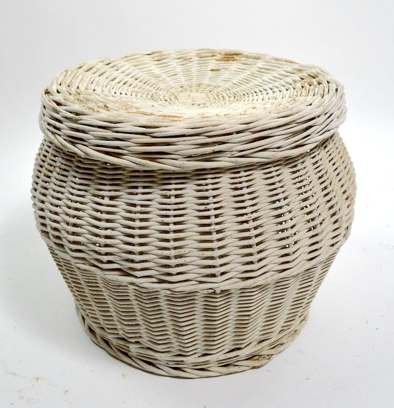 Decorative wicker baskets with removable lid tops. Suitable for use as storage and or end or side table. Priced and offered individually, however we would love to see them stay together.
Please view the matching high back chairs we have listed from