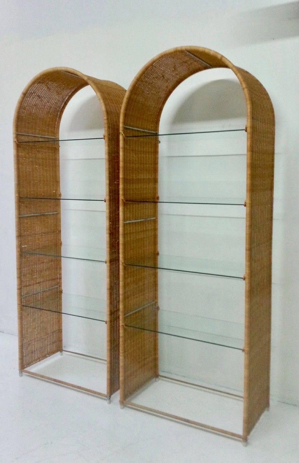 Elegant pair of matching wicker and glass bookshelves by Danny Ho Fong for Tropi-cal. Excellent vintage condition. Sold as a set.