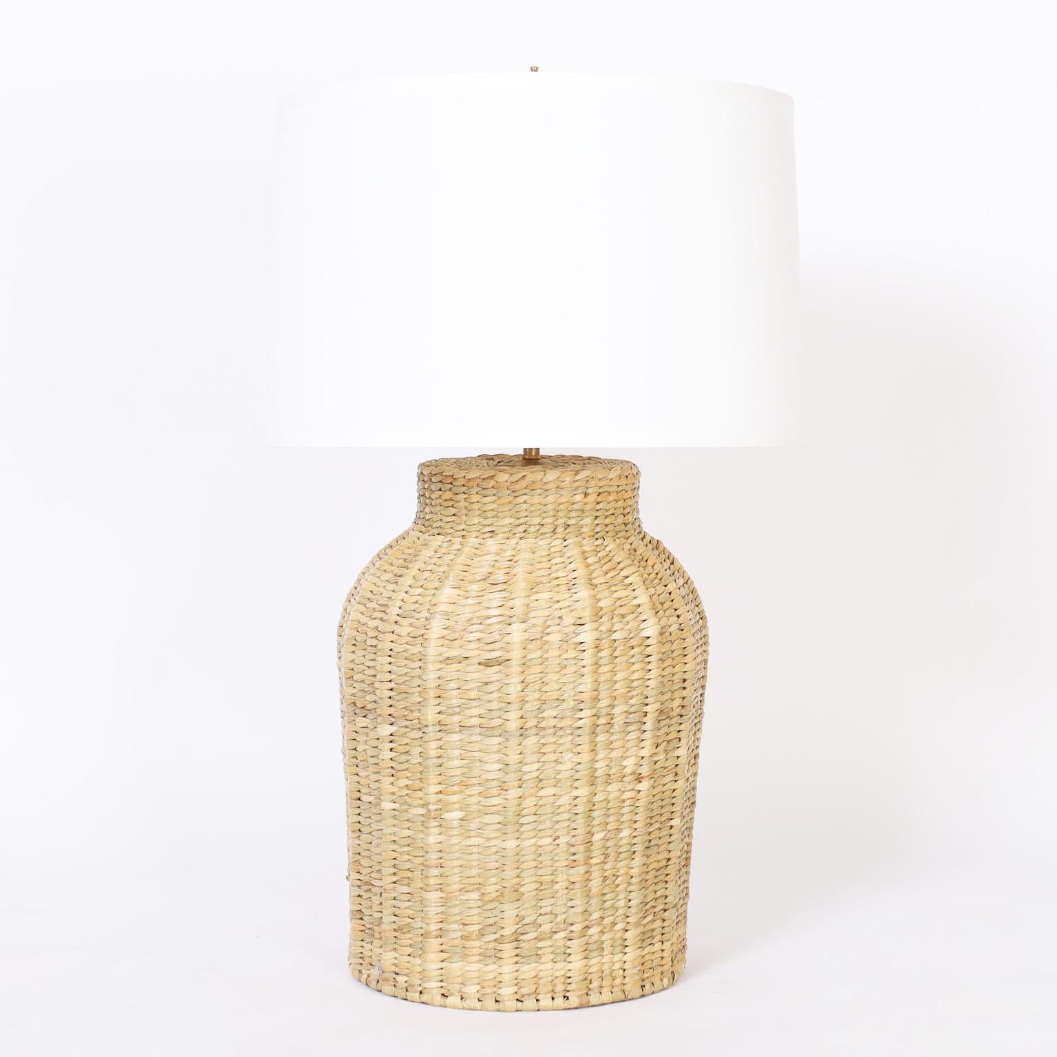 Asian modern style table lamps hand crafted in wicker or reed in a classic bottle form, in a bold scale from the FS Flores Collection designed and offered exclusively by F.S. Henemader Antiques.
 