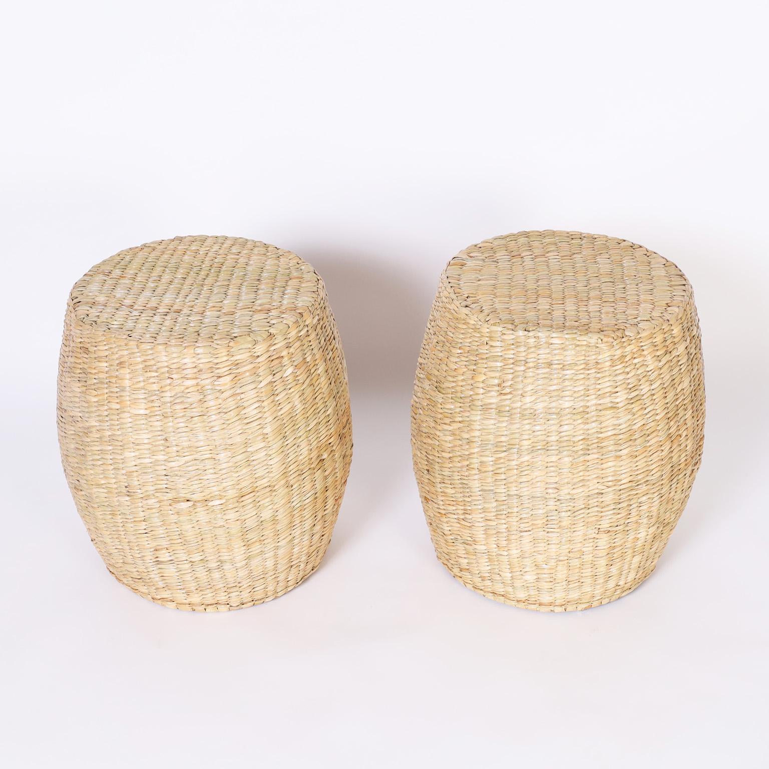 Pair of garden seats or stools crafted in reed expertly wrapped over a sturdy metal frame with the highest quality, exclusively designed and offered by F.S. Henemader antiques as part of the FS Flores Collection.