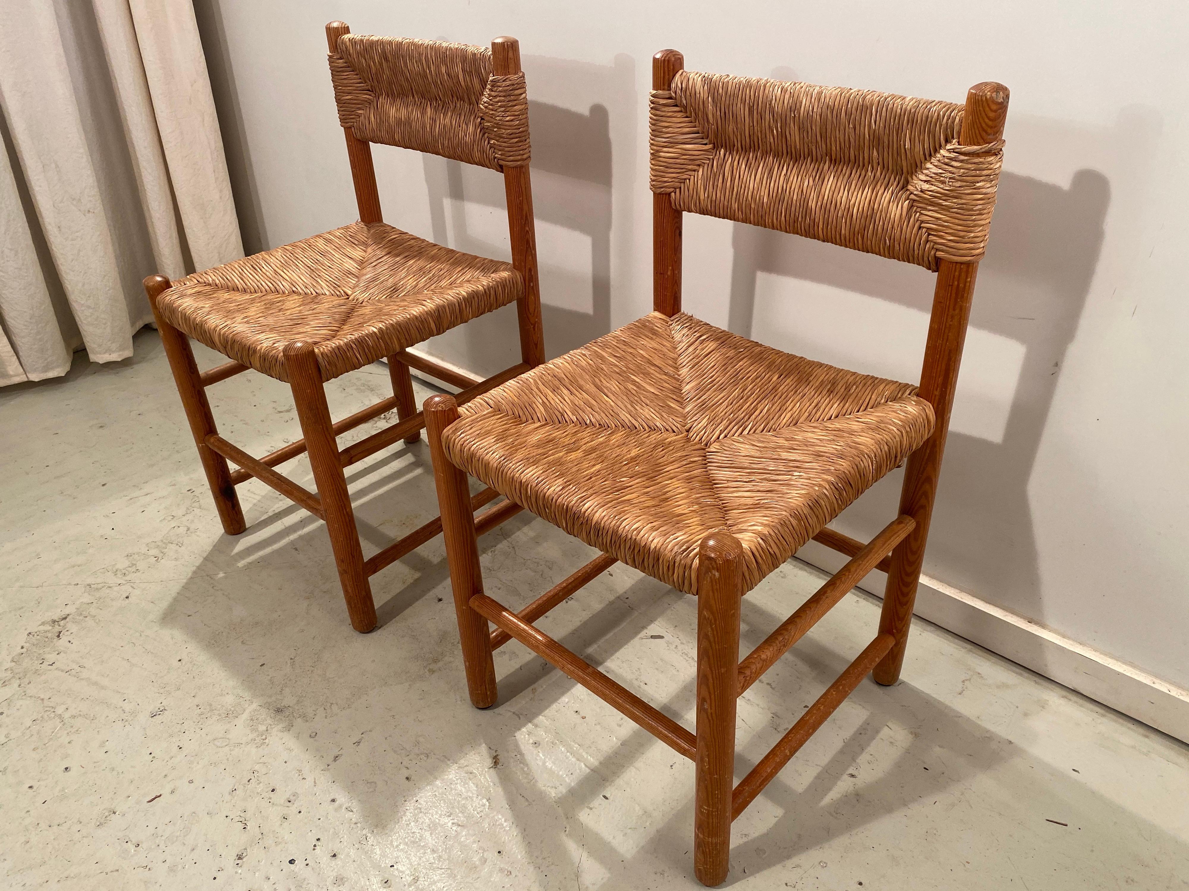 Beautiful pair of dining chairs from the Dordogne series by Charlotte Perriand for Robert Sentou. The wicker seat and back of both chairs are in good vintage condition.
See other listing for another pair of these chairs; the frame of all 4 are