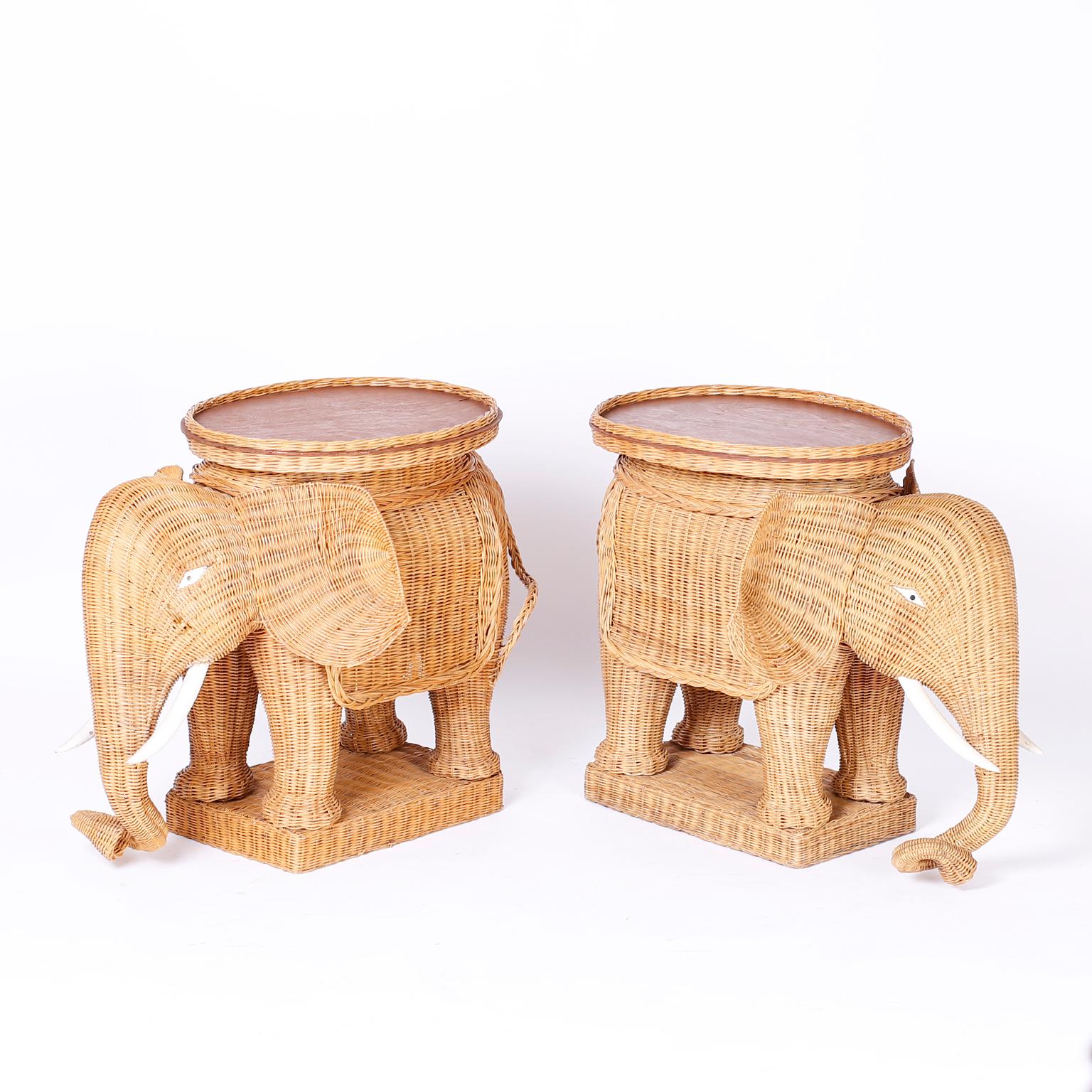 Pair of wicker elephant stands in rare immaculate condition, with wood tusks on wicker bases with removable serving trays on top.