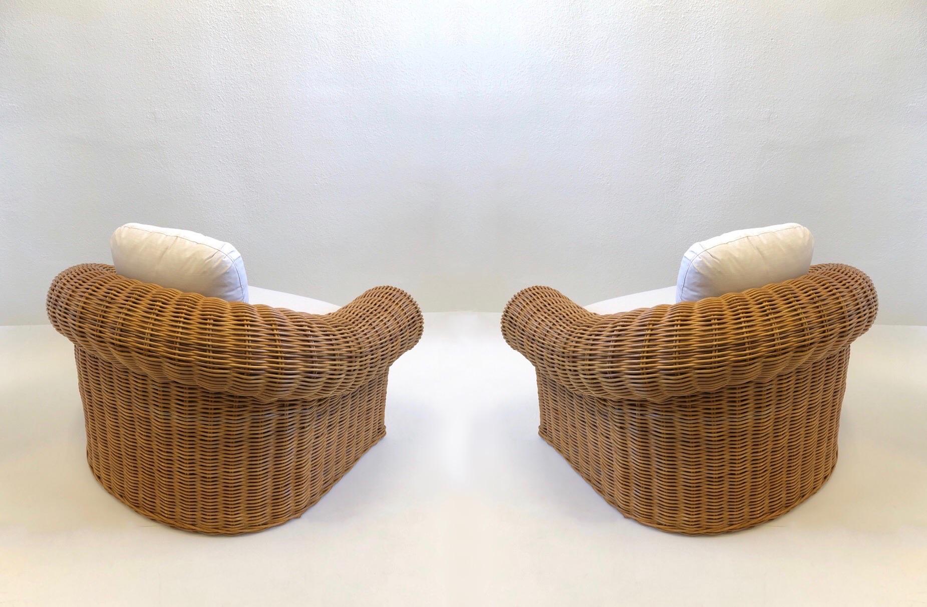American Pair of Wicker Lounge Chairs and Ottoman in the Style of Michael Taylor