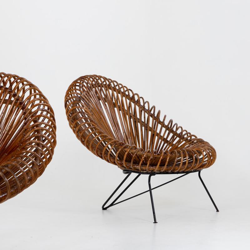 A pair of sculptural chairs designed by Janine Abraham and Dirk Jan Rol for Edition Rougier. 
Crafted in rattan and painted metal.