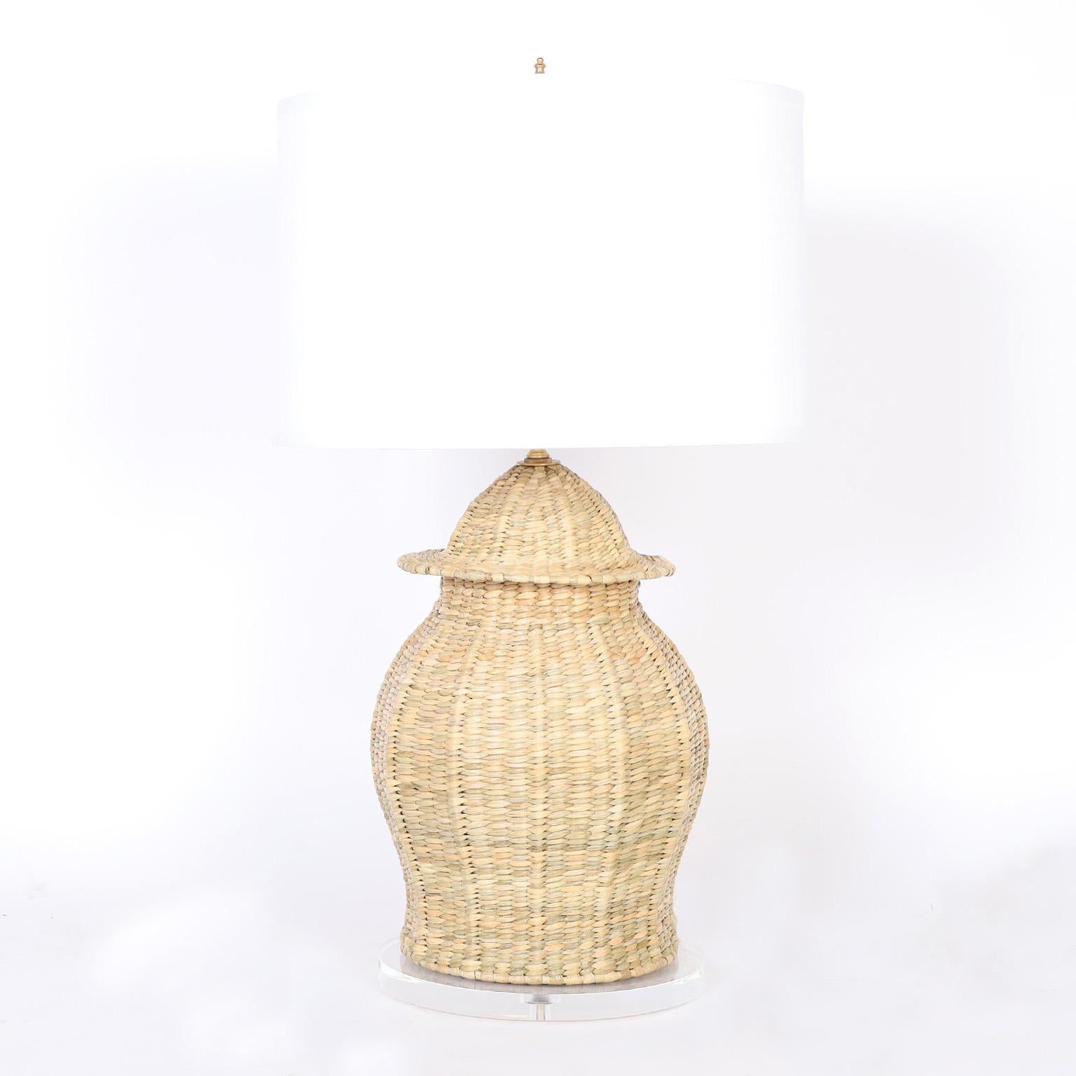 Asian modern style table lamps crafted in chuspata, much like wicker or reed in a classic ginger jar form and presented on lucite bases, from the FS Flores Collection, designed and offered exclusively by F.S. Henemader Antiques.