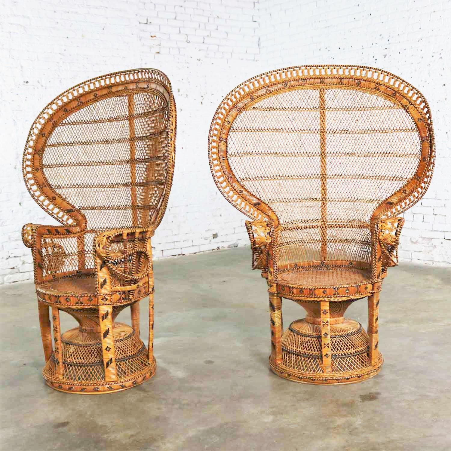 Awesome pair of vintage Bohemian or Hollywood Regency wicker rattan peacock fan back chairs. Both chairs are in wonderful vintage condition. One chair had lost some of its rattan wrap on one of its legs, but we have replaced it beautifully. We have