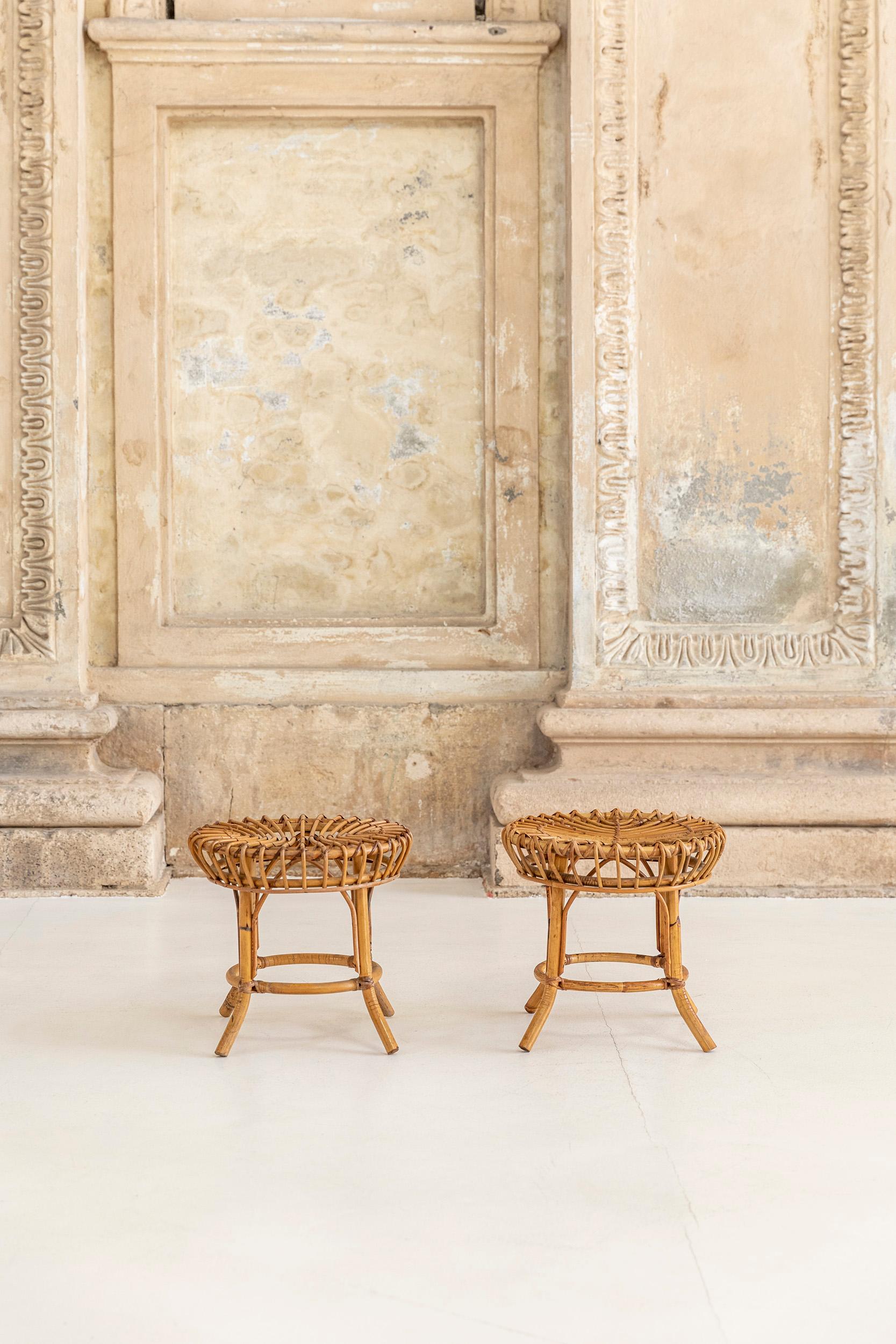 Pair of vintage low stools made of woven wicker wood. 
Excellent condition, they can be used indoor and outdoor.