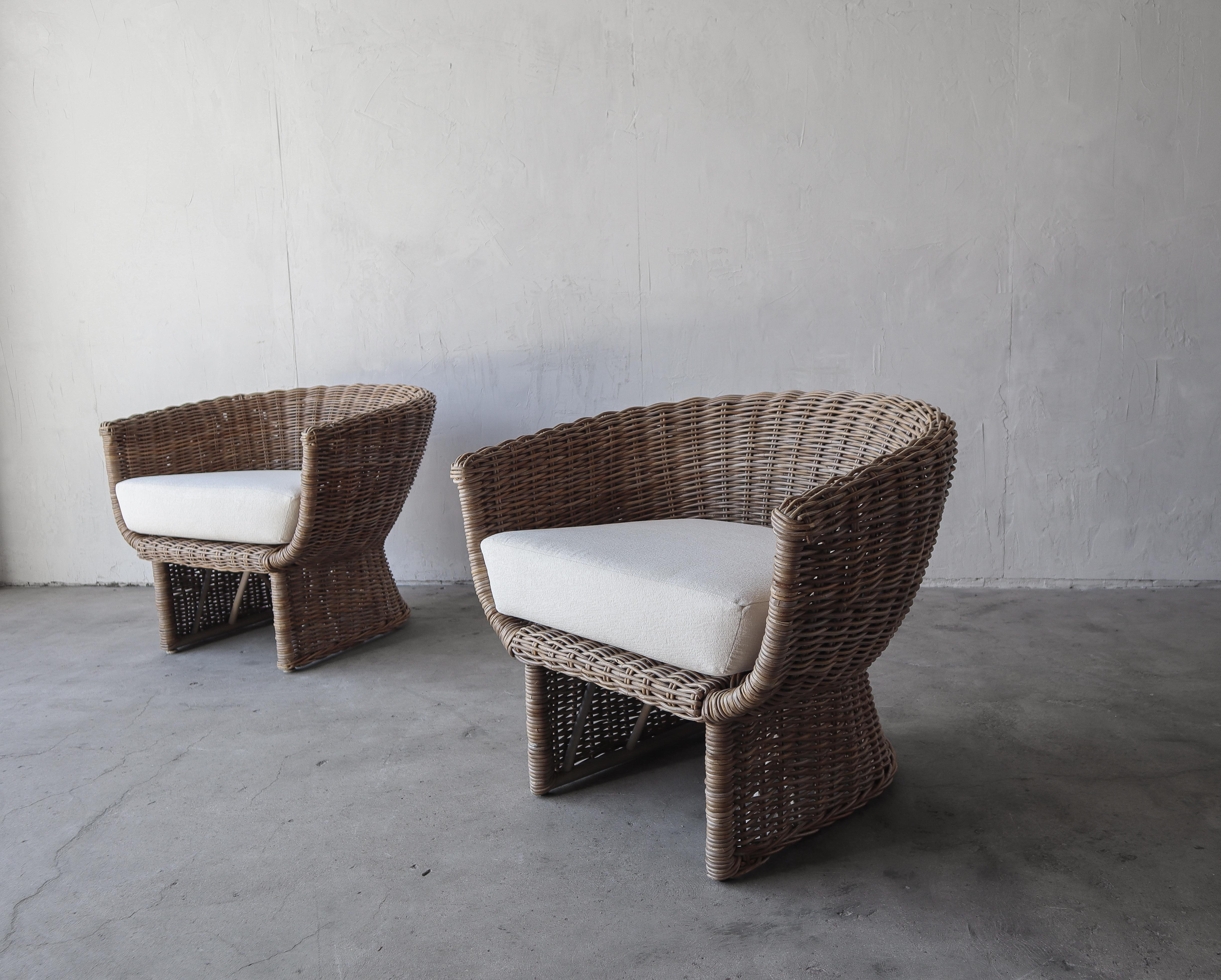 Super stylish pair of wicker tub chairs. Can be used indoor or out.  Wicker is woven over a metal frame making them extremely durable.

Chairs are in excellent condition with all new foam and fabric. Fabric is not outdoor fabric.