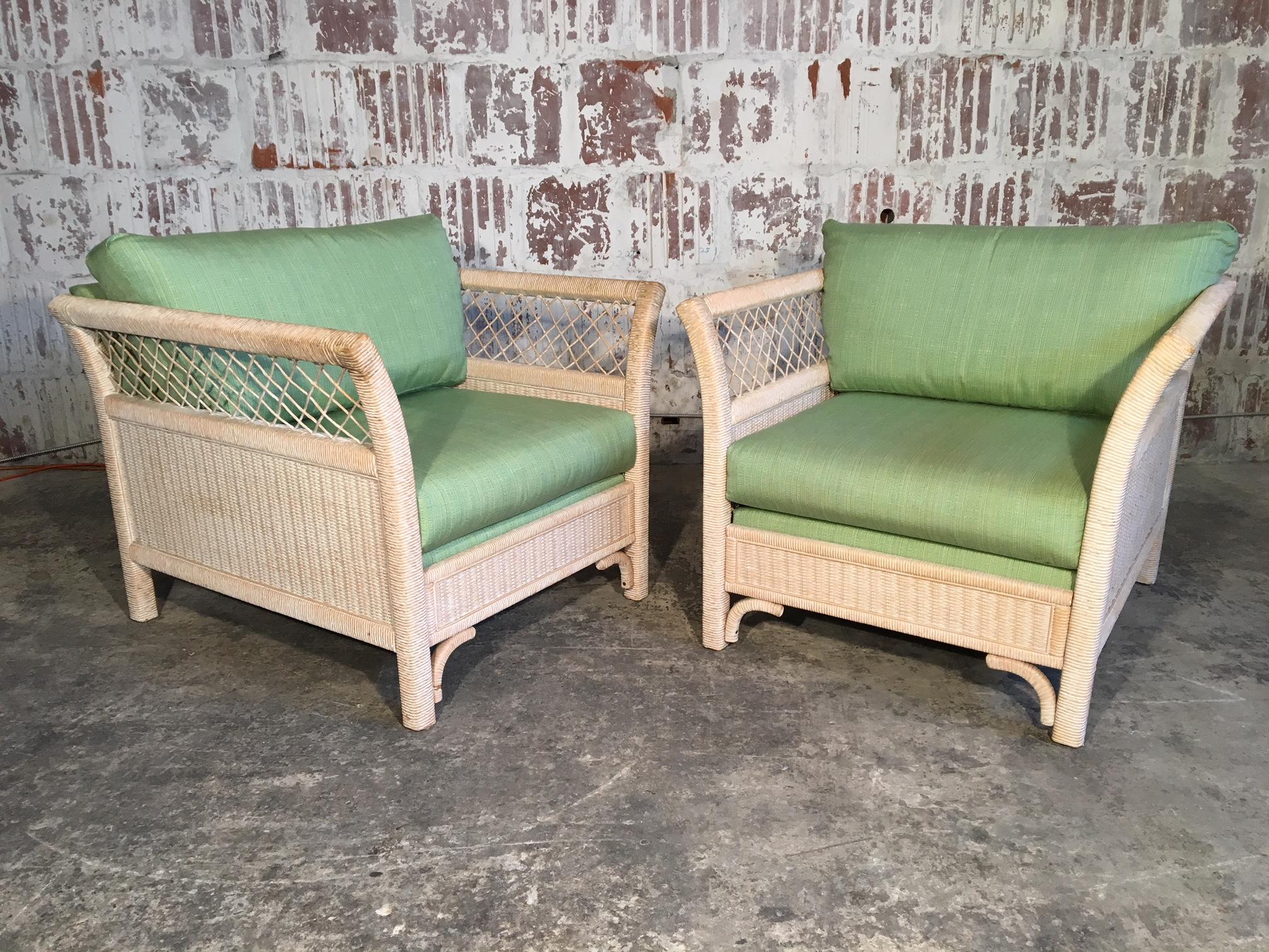 Pair of wicker tuxedo chairs by Henry Link for Lexington Furniture. Very good condition with only very minor signs of age appropriate wear. Professional reupholstery available.