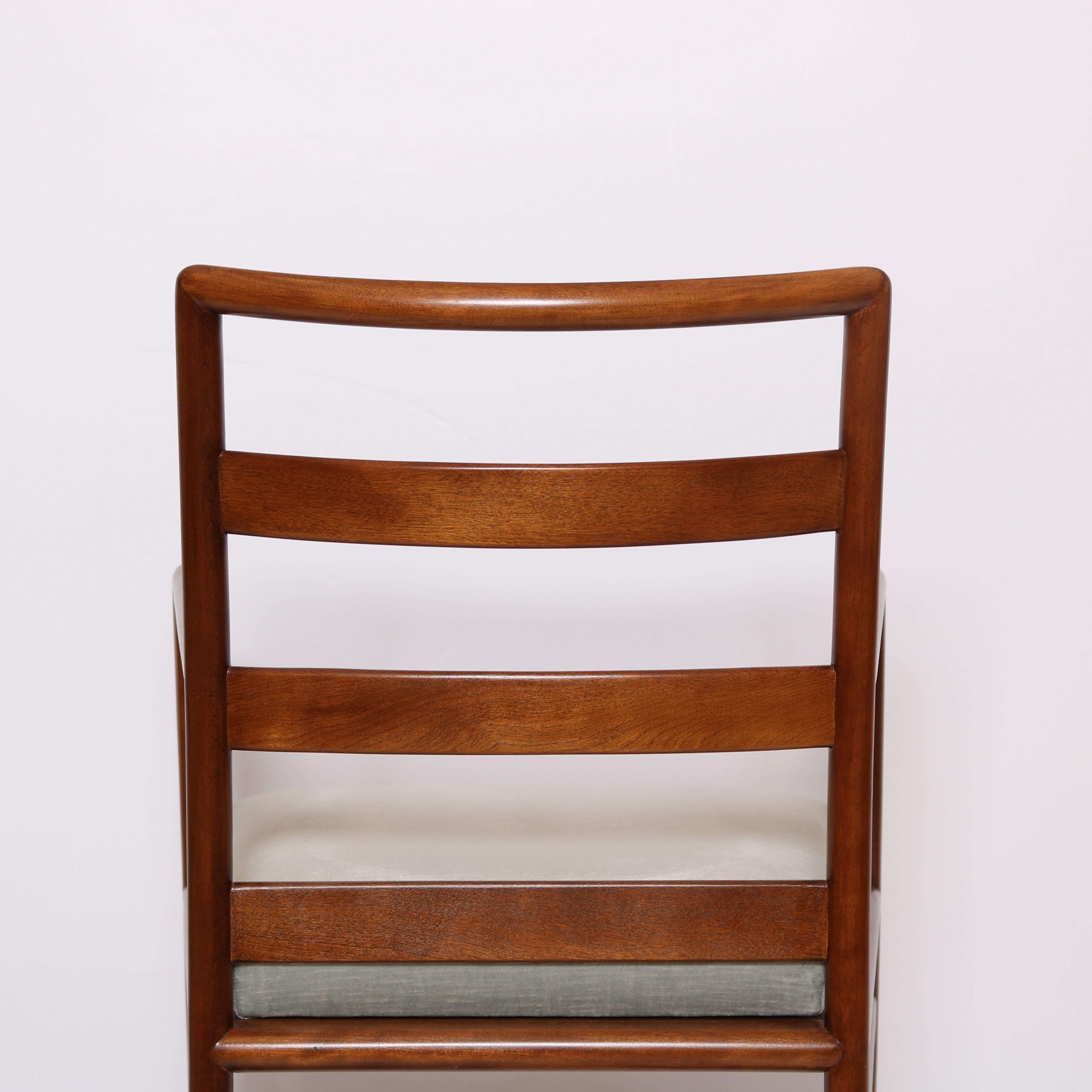 A pair of Widdicomb armchairs designed by T.H. Robsjohn Gibbings.
Mahogany frames.