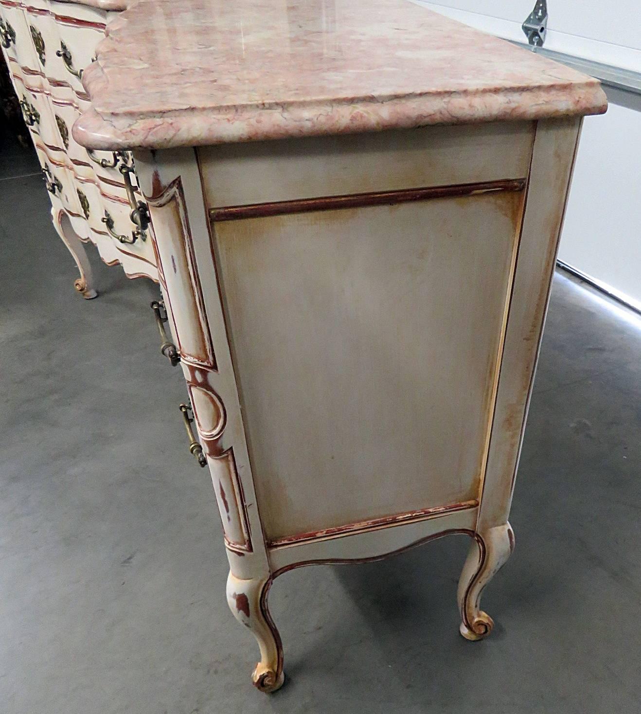 Pair of Widdicomb Swedish style three-drawer marble top end tables.