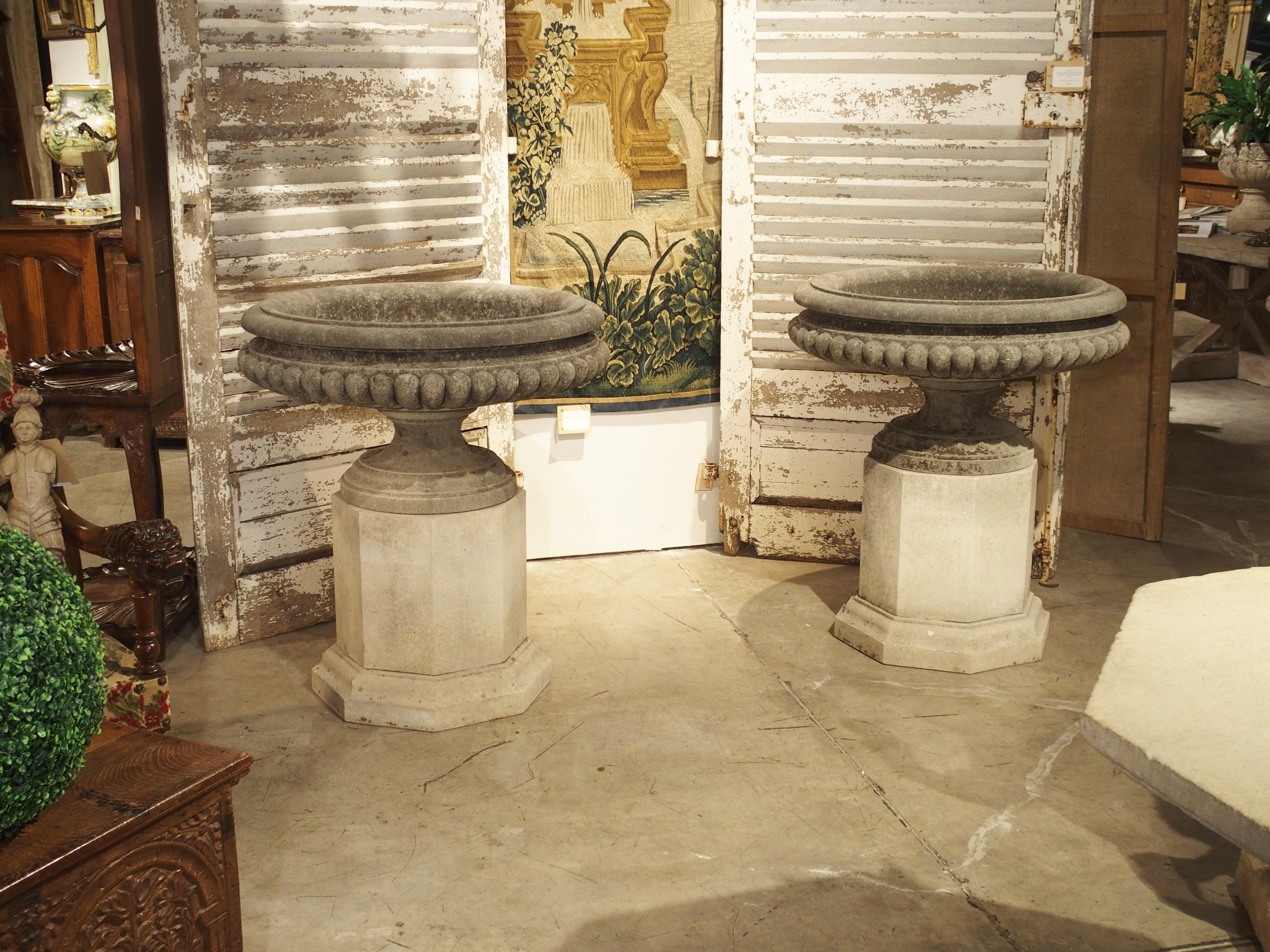 Pair of Wide Lobed Stone Urns on Octagonal Plinths 6