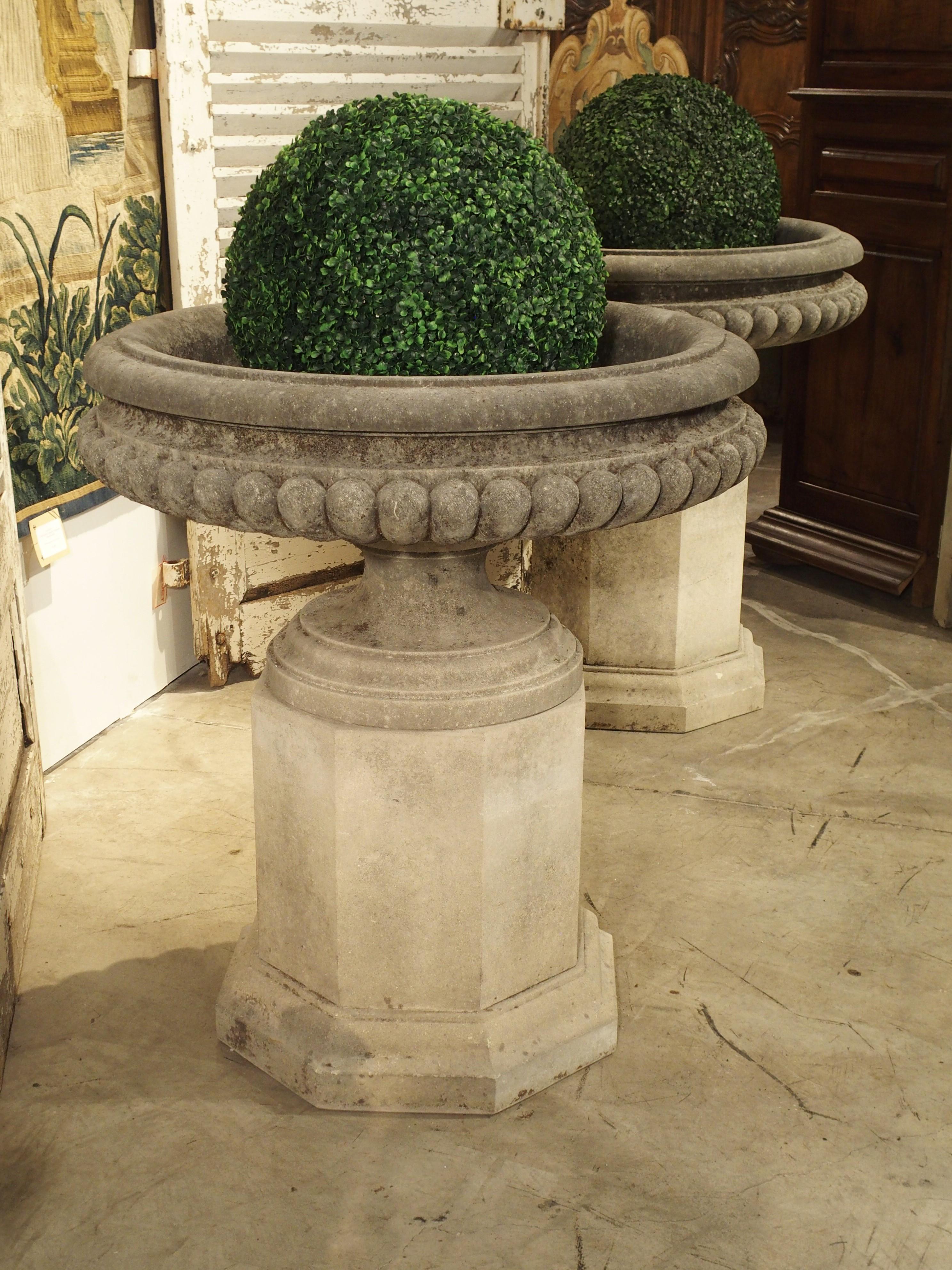 Pair of Wide Lobed Stone Urns on Octagonal Plinths 7