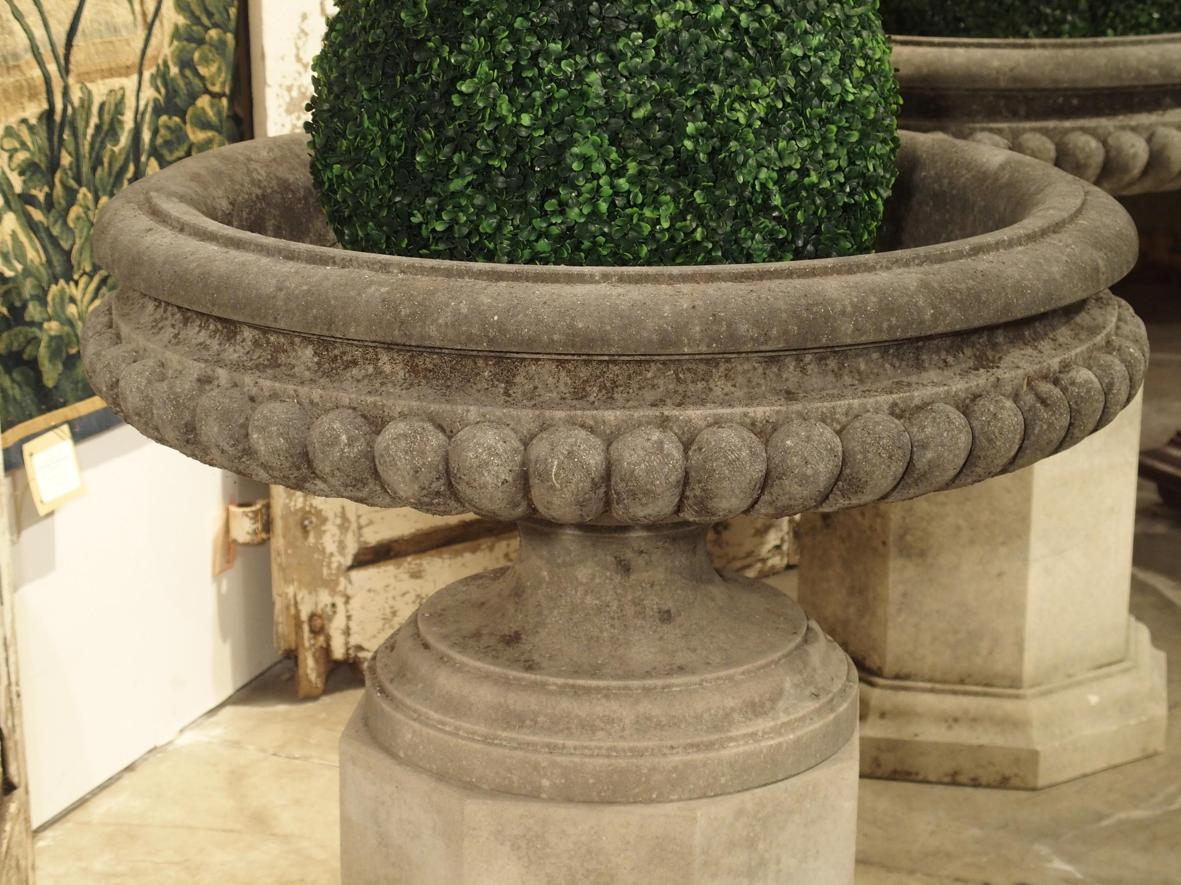 Pair of Wide Lobed Stone Urns on Octagonal Plinths 8