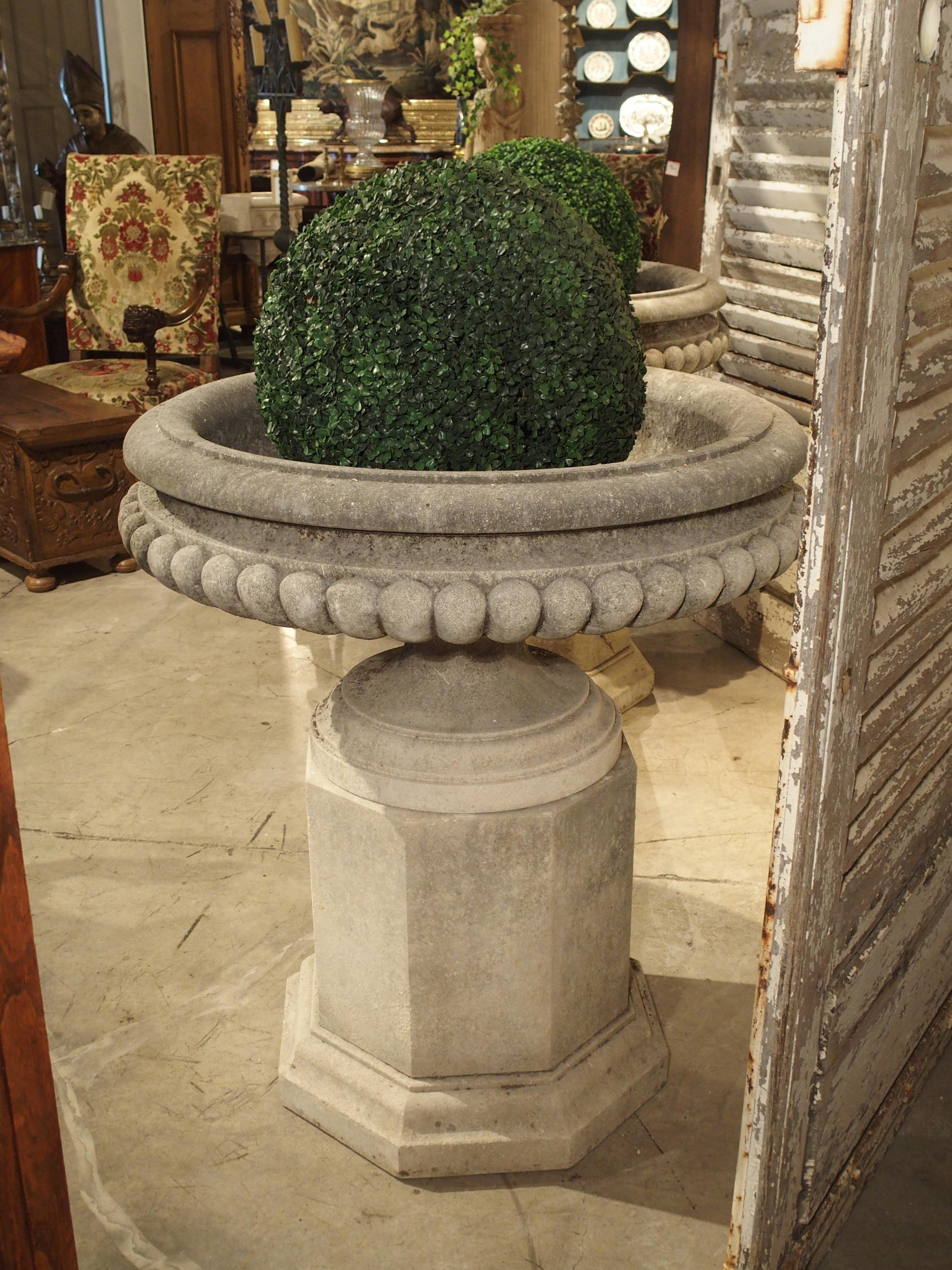 Pair of Wide Lobed Stone Urns on Octagonal Plinths 9