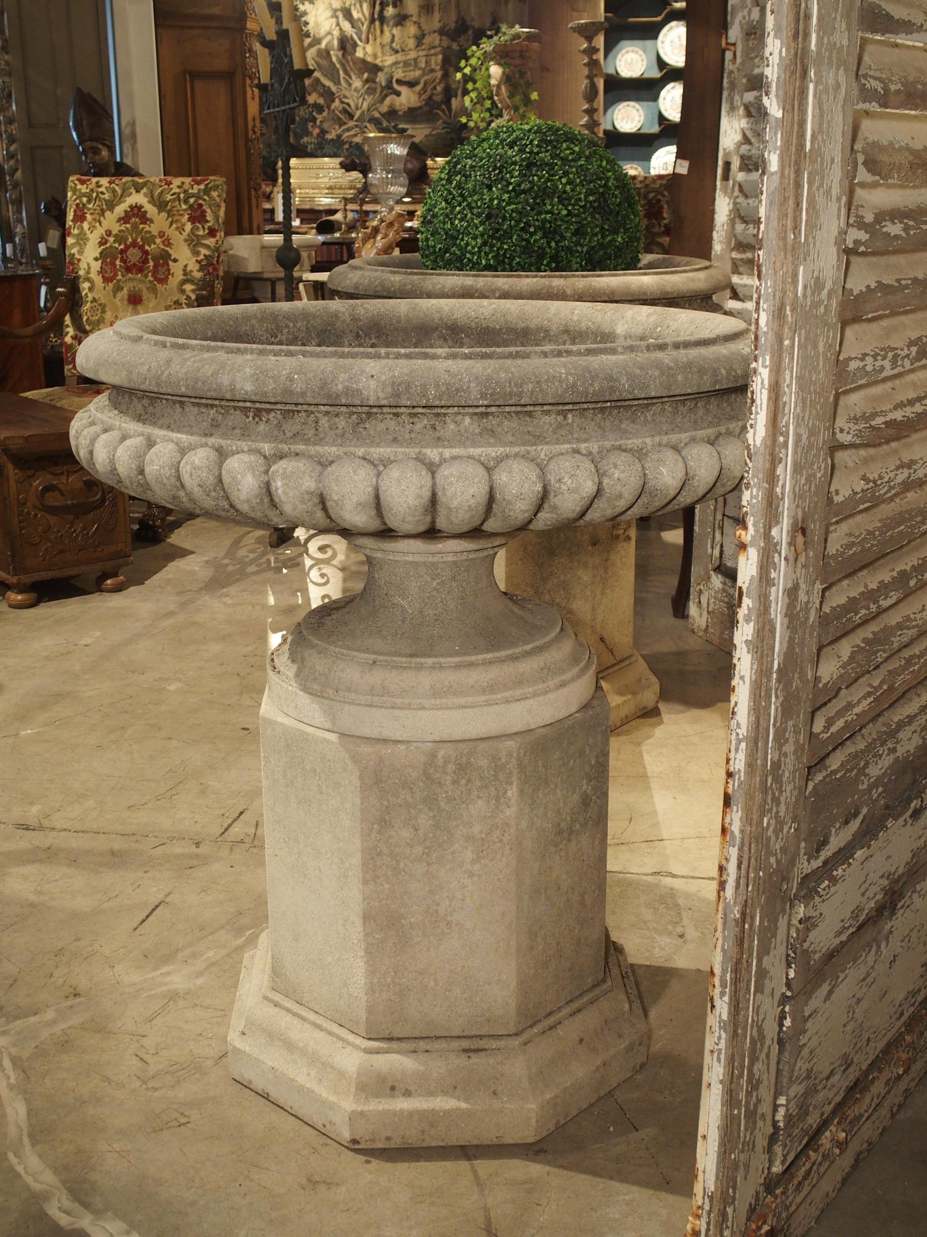 Pair of Wide Lobed Stone Urns on Octagonal Plinths 10