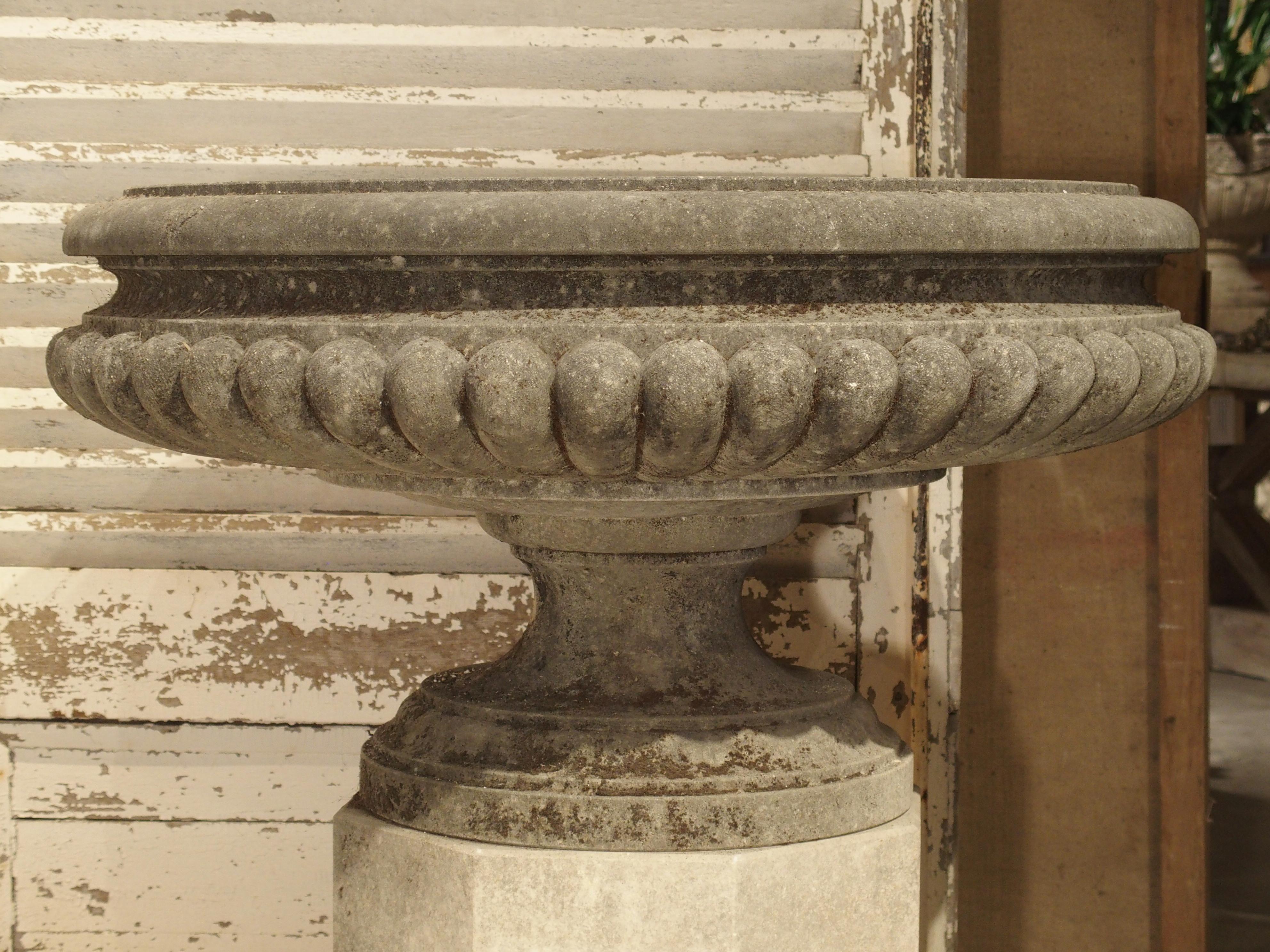 Limestone Pair of Wide Lobed Stone Urns on Octagonal Plinths