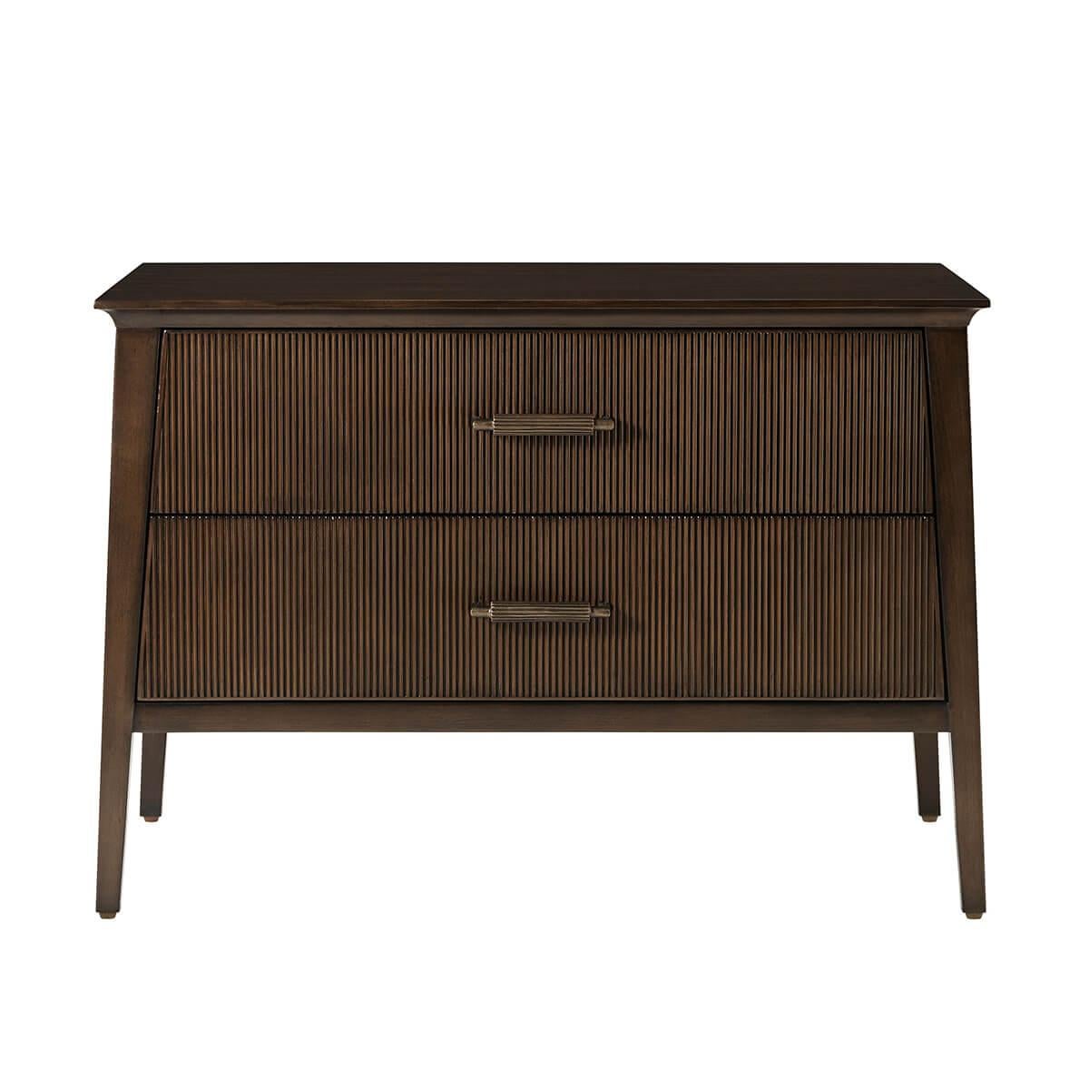 Featuring a sophisticated tapered silhouette with two reeded drawer fronts. The custom forged hardware, finished in a dark rubbed bronze, echoes the reeded details throughout.

Dimensions: 32