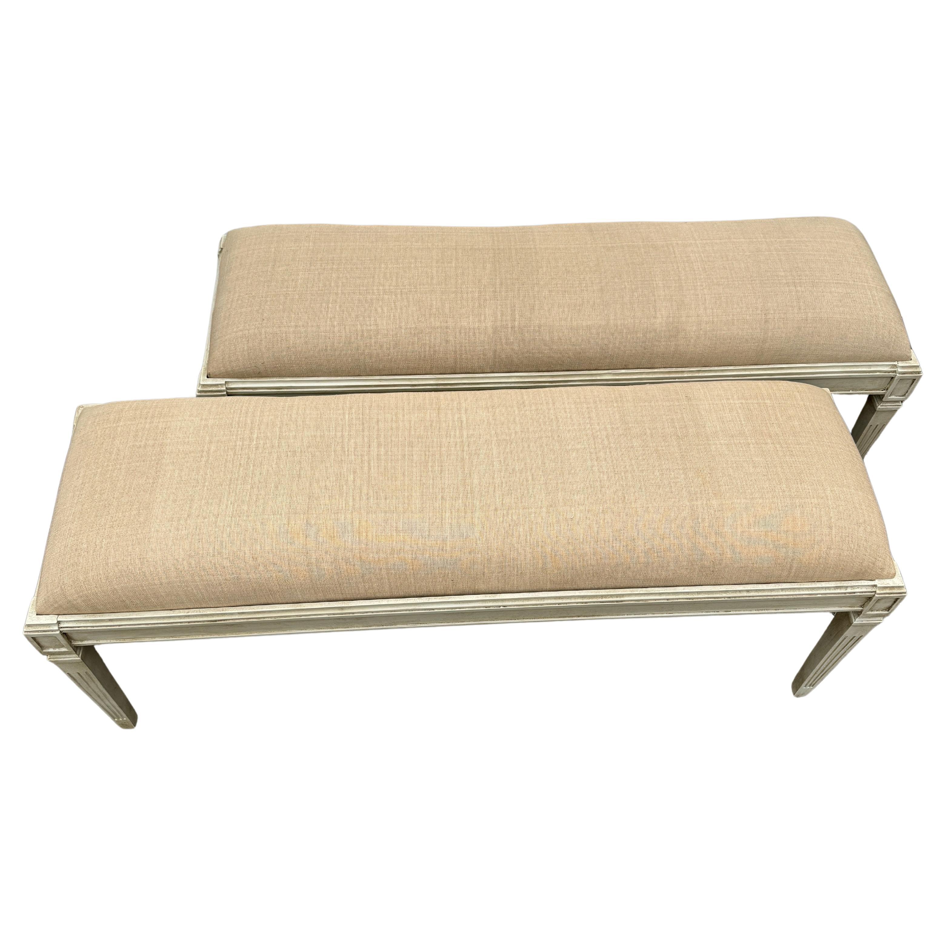 Swedish Gustavian Style Painted Upholstered Benches, A Wide Pair

Hand painted and hand distressed wood benches fully upholstered in a neutral linen textile. Wonderful additions to any style home, used formally or informally in an entrance area,