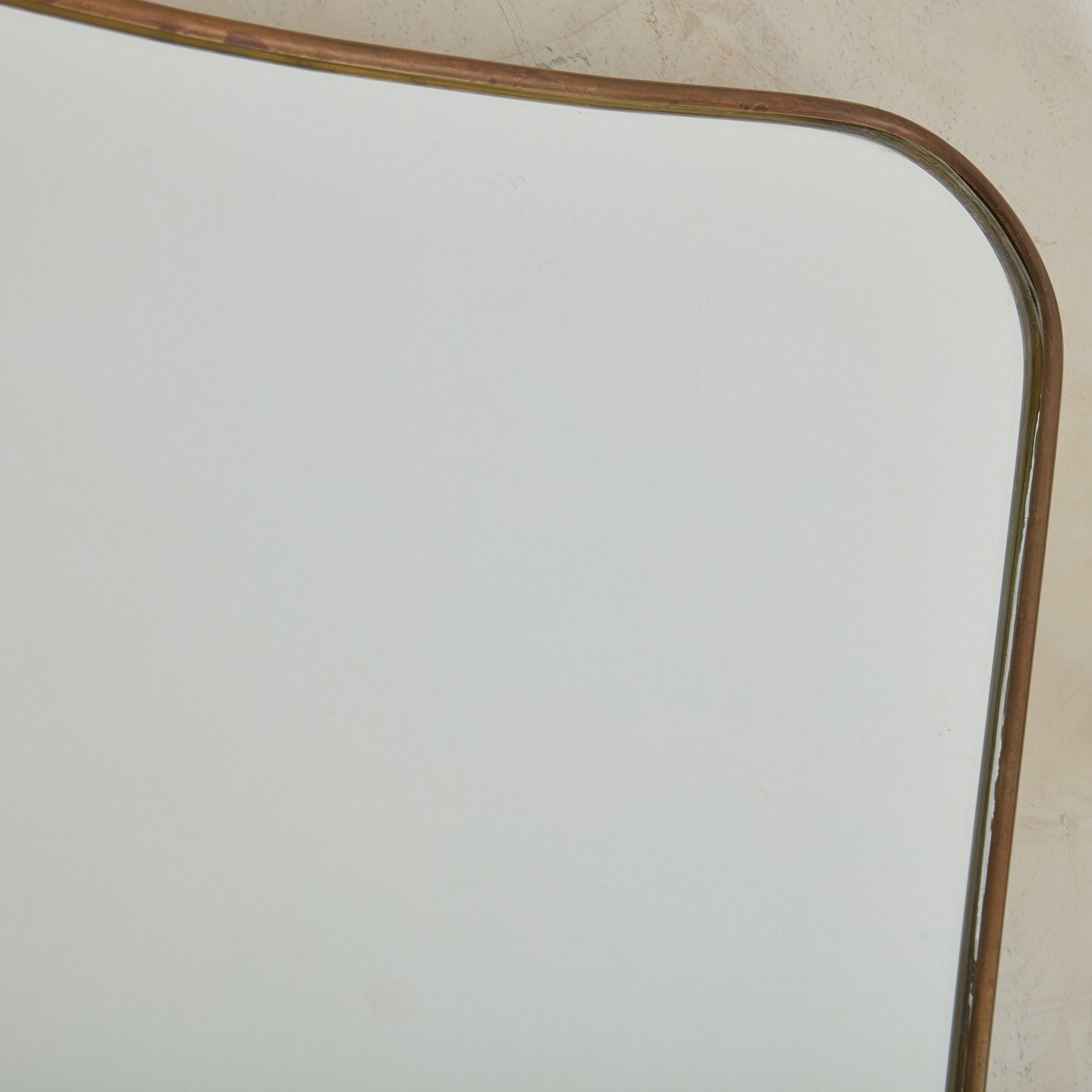 Italian Pair of Wide Scoop Top Patinated Brass Mirrors, 20th Century For Sale
