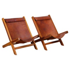 Pair of wide wood and leather armchairs from the 1980s