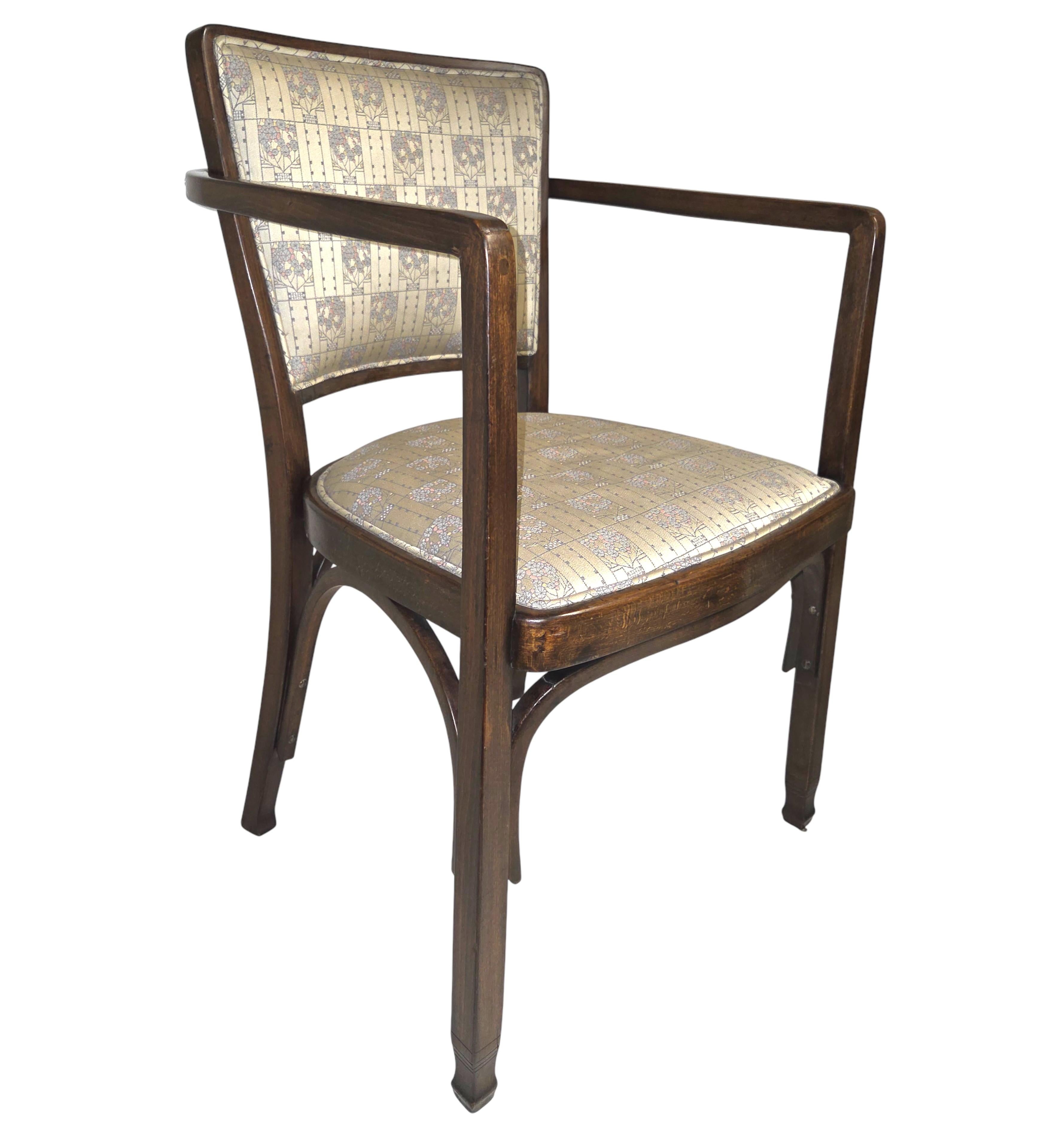 A fine pair of Austrian Secessionist bentwood chairs in walnut stained beechwood with upholstered seat and back.
Designed by Koloman Moser: March 30, 1868 – October 18, 1918    
Manufactured by J & J Kohn in 1910
Geometric arms and square back rests