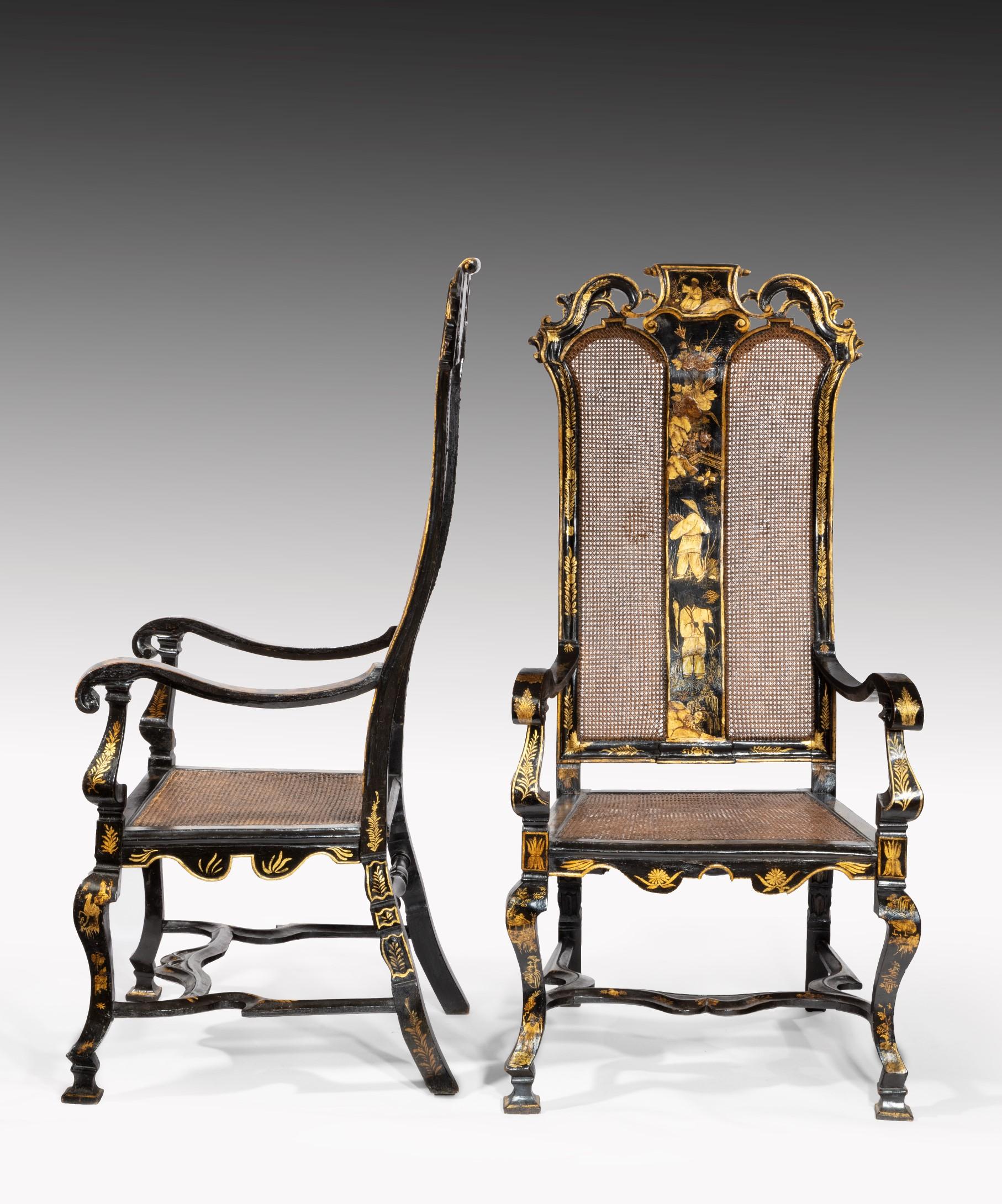 An exceptional pair of William III period japanned and lacquered armchairs; the armchairs' high back with a carved and pierced cresting rail above a lacquered central splat flanked by panels of caning; having elegantly curved arms above a caned seat