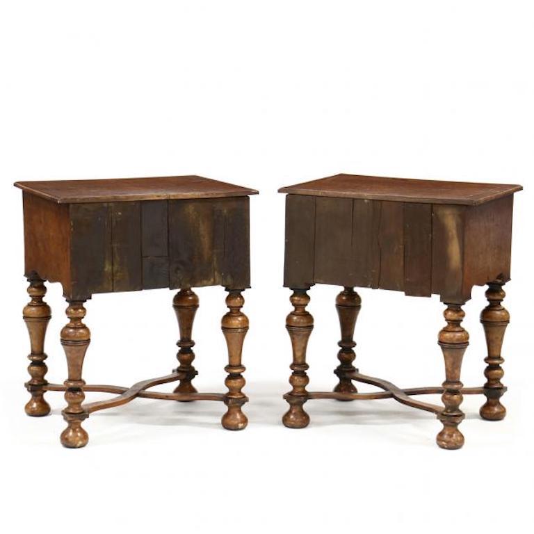 Pair of William and Mary Burl walnut lowboys

Early 20th century, pine secondary, rectangular top with banded edge and line inlay, cut corners, the case with one over three cock beaded drawers, scalloped skirt, bold turned legs with shaped cross