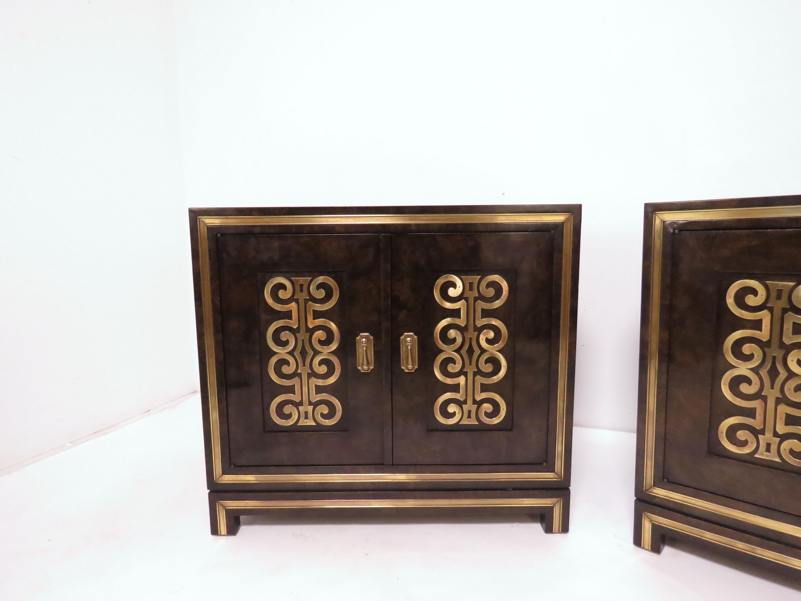 Pair of chests in amboyna burl with brass scroll panels and trim, by William Doezema for Mastercraft, circa 1960s.