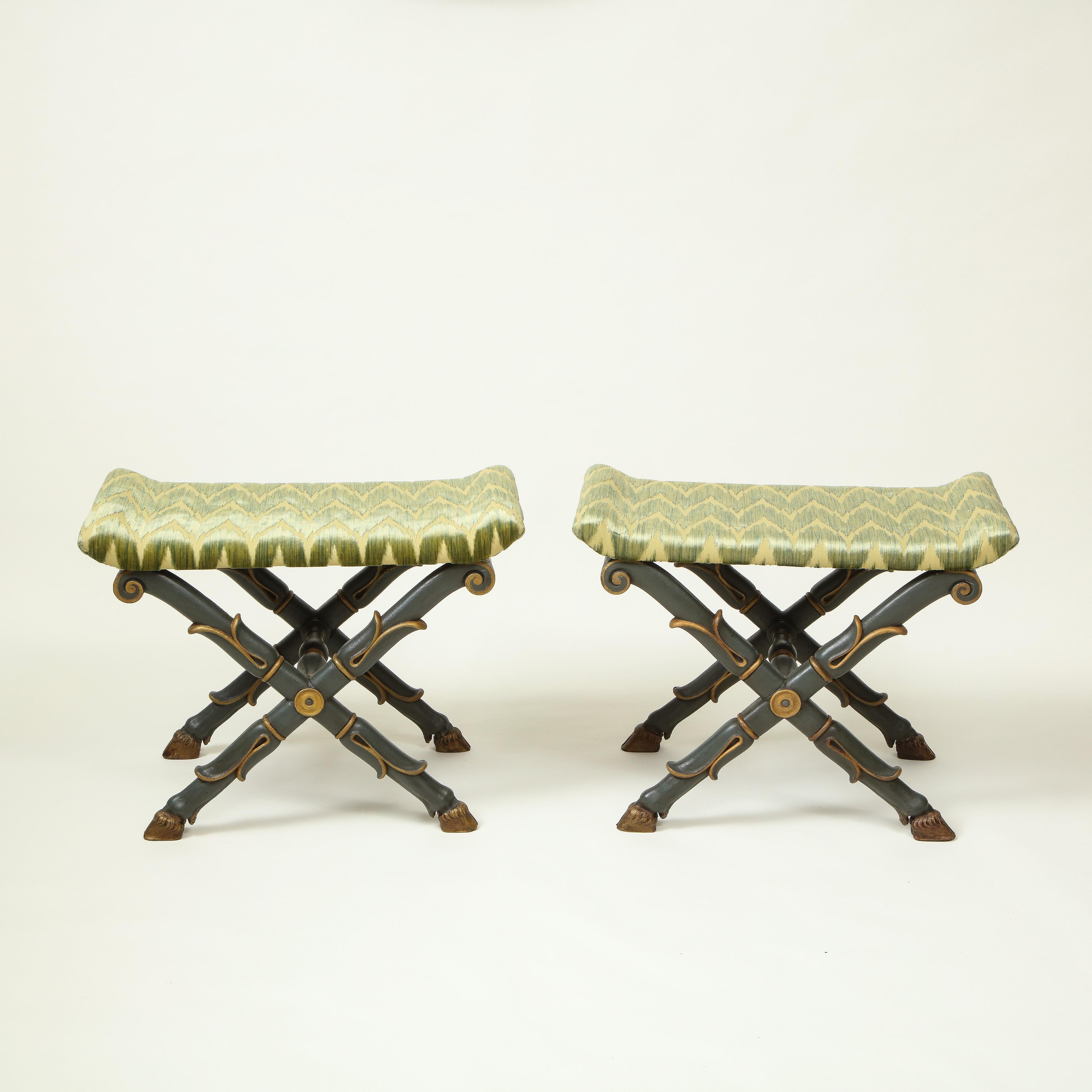 Each rectangular seat with outscrolled ends upholstered in green silk velvet; raised on bronzed and gilt lotus leaf-wrapped X-form supports joined by a turned boss and terminating in hoof feet.

Provenance: From the Collection of Mario Buatta, New