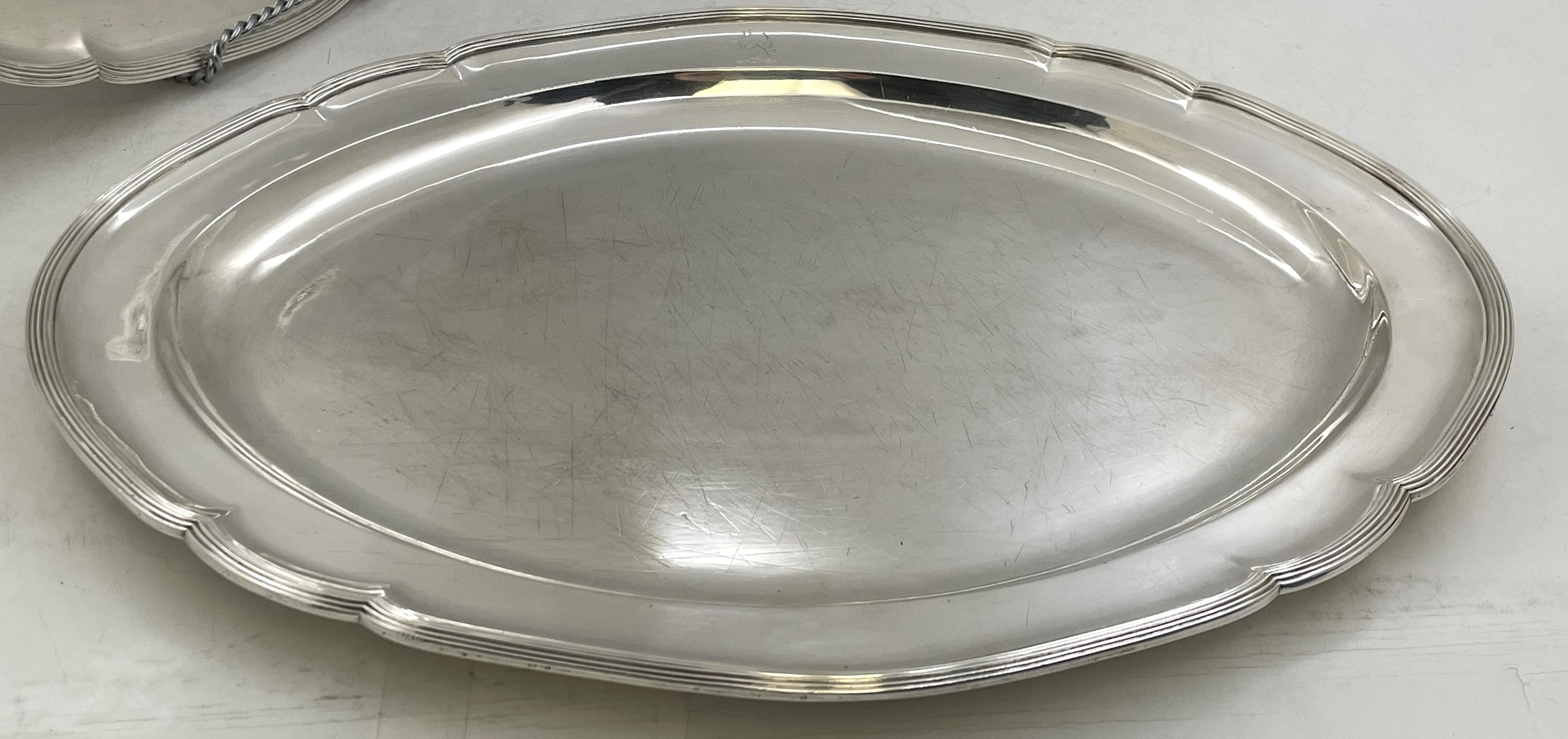Pair of William Pitts, English sterling silver Georgian platter trays from 1790, with gadrooned rims, in an elegant, geometric design. They measure 15 3/4'' in depth by 12'' in width by 1'' in height, weigh 74 troy ounces, and bear hallmarks as well