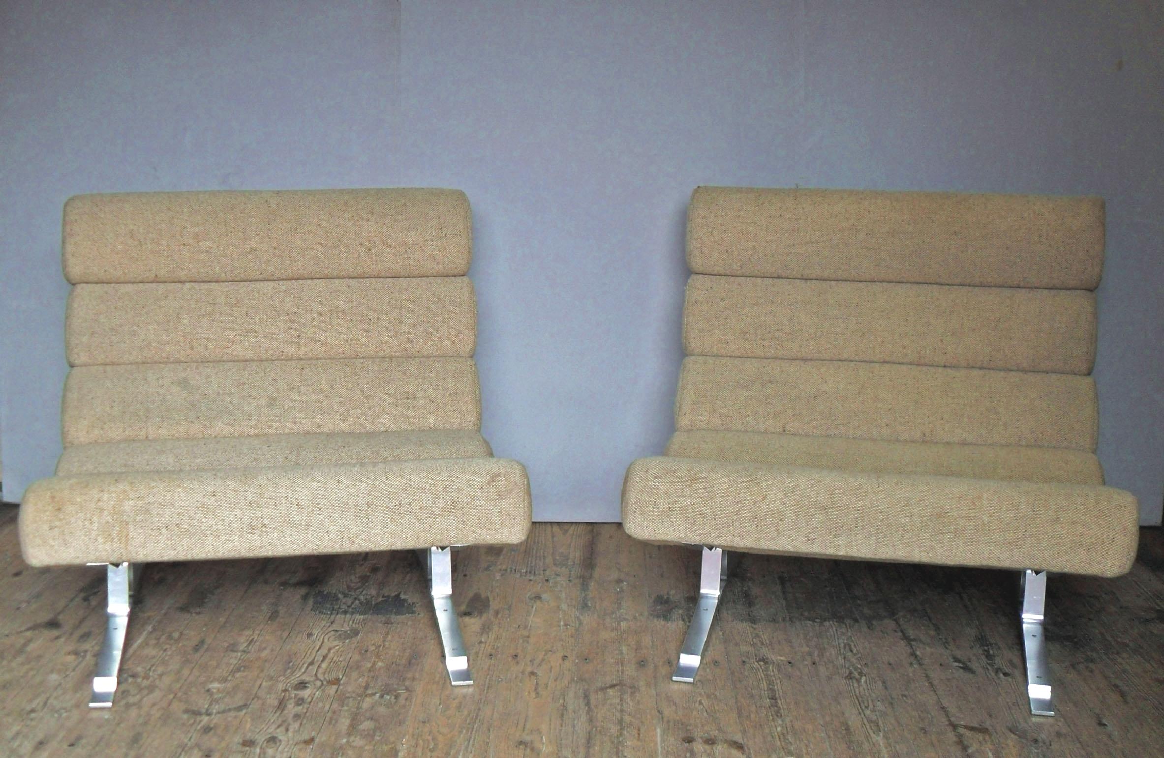 A stylish and very comfortable pair of midcentury Kingston chairs by British designer William Plunkett. The chairs have a stainless steel frame with a polished aluminium coating with six foam rolls upholstered in their original oatmeal coloured