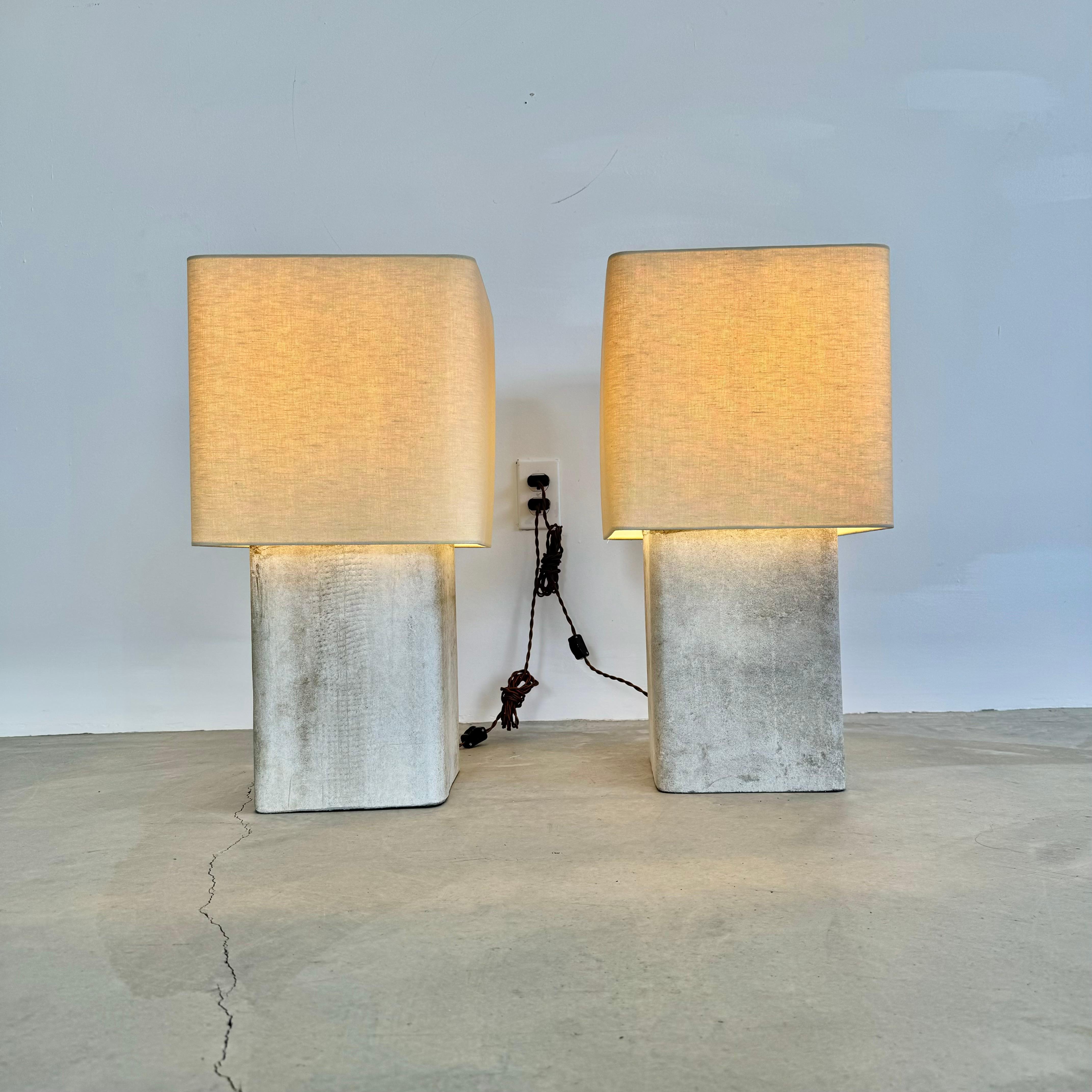 Stunning pair of large concrete Willy Guhl lamps by Eternit with teak top cover. Concrete made in Swizterland. Newly fitted as a lamp, re-wired with a new custom linen shade and light diffusor on top. Stunning simplicity and beautiful texture make