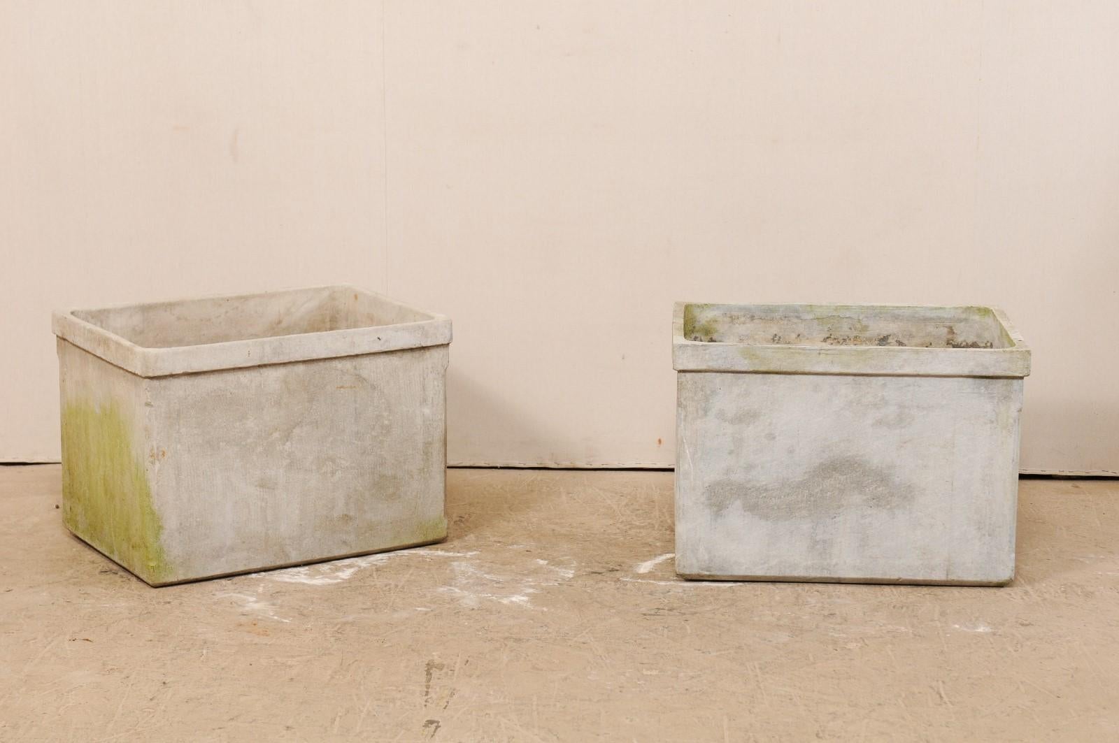 A pair of eternite planters attributed to Willy Guhl, mid-20th century. This pair of rectangular-shaped planters are a nearly perfect pair, only noticeable difference being that one has more squared rim corners while the other is more rounded. The