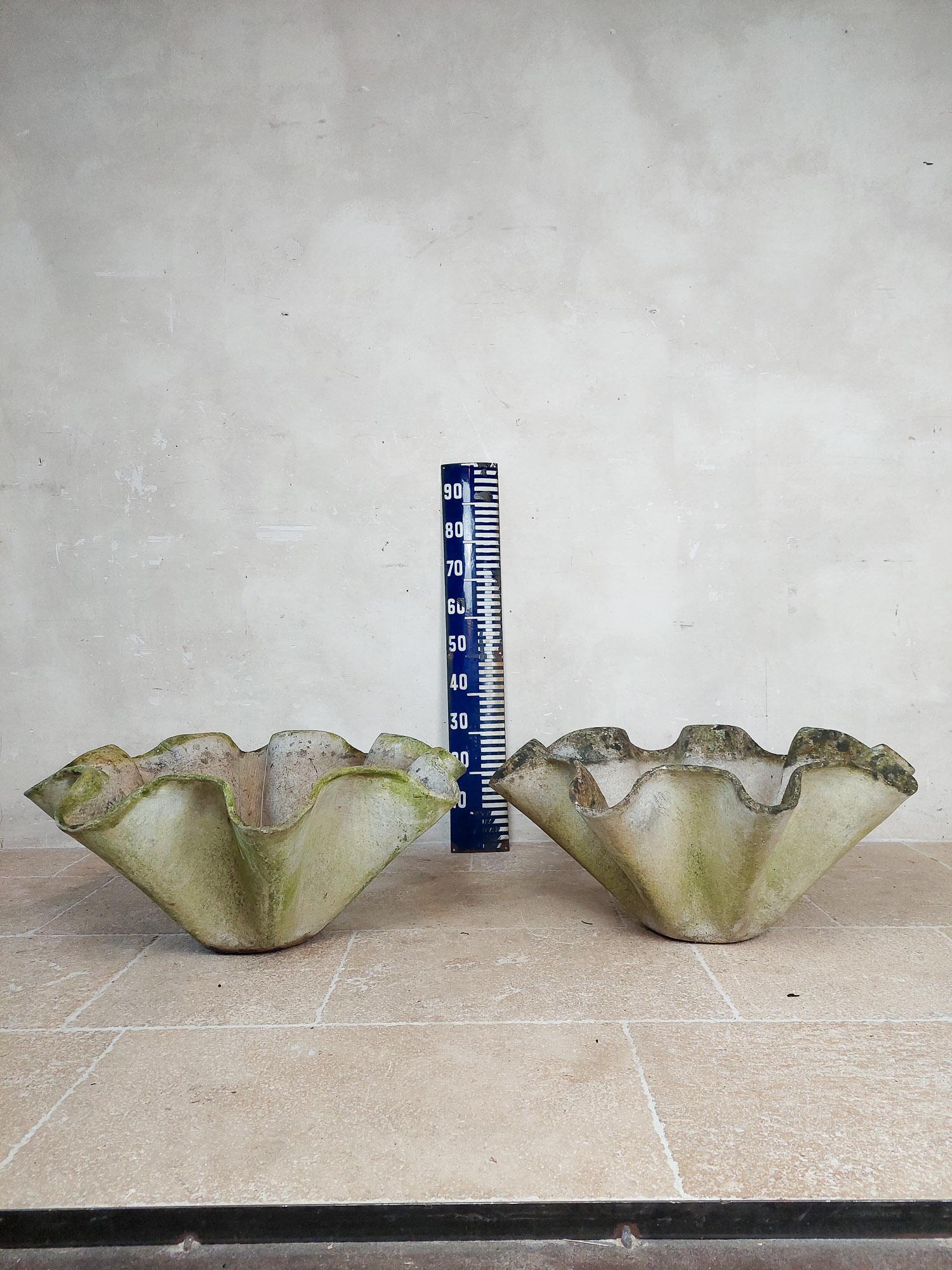Beautifully shaped large pair of biomorphic pots by Swiss architect Willy Guhl. Manufactured by Eternit AG, who produced all of Guhl's designs. These pots look similar to the handkerchief planters by Willy Guhl, but a have little more the looks of