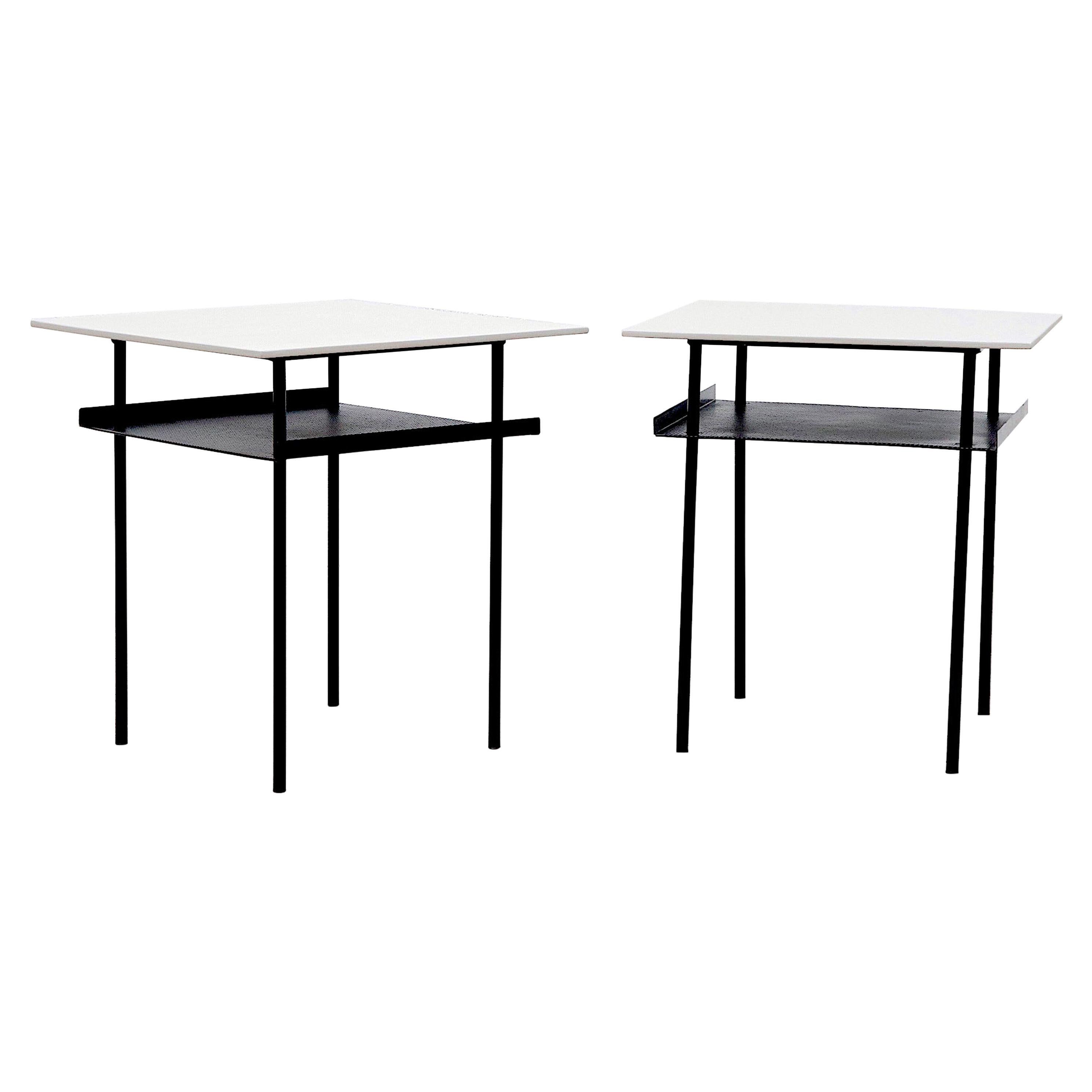 Lightly refinished modernist pair of Wim Rietveld side tables with pale grey painted plywood tops, black enameled metal frames with perforated sheet metal lower shelves with bent-up edges. Tops are painted in pale grey. Set price.