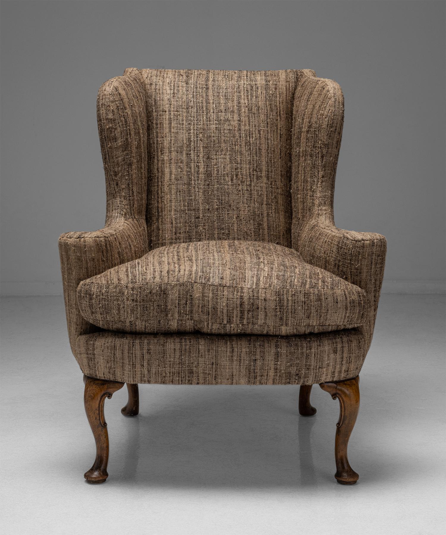 Pair of wing armchairs

England circa 1930

Newly upholstered armchairs on carved cabriole legs.