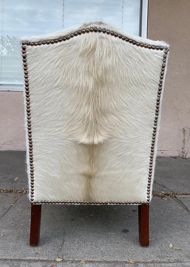 Pair of Wingback Chairs 1 in Brown Cowhide and 1 in White Cowhide