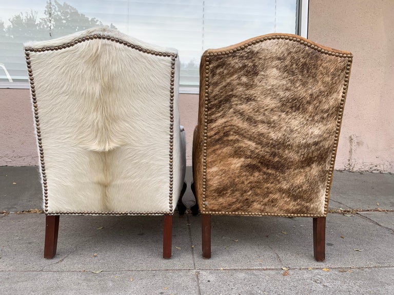 Pair of Wingback Chairs 1 in Brown Cowhide and 1 in White Cowhide