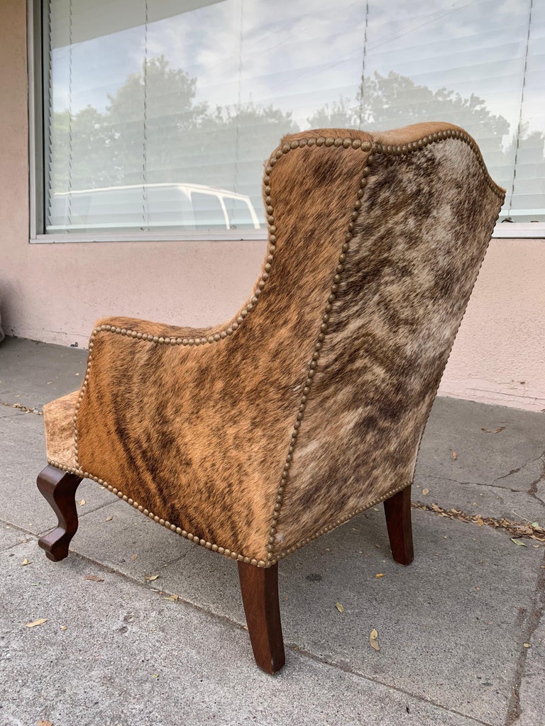 Pair of Wingback Chairs 1 in Brown Cowhide and 1 in White Cowhide
