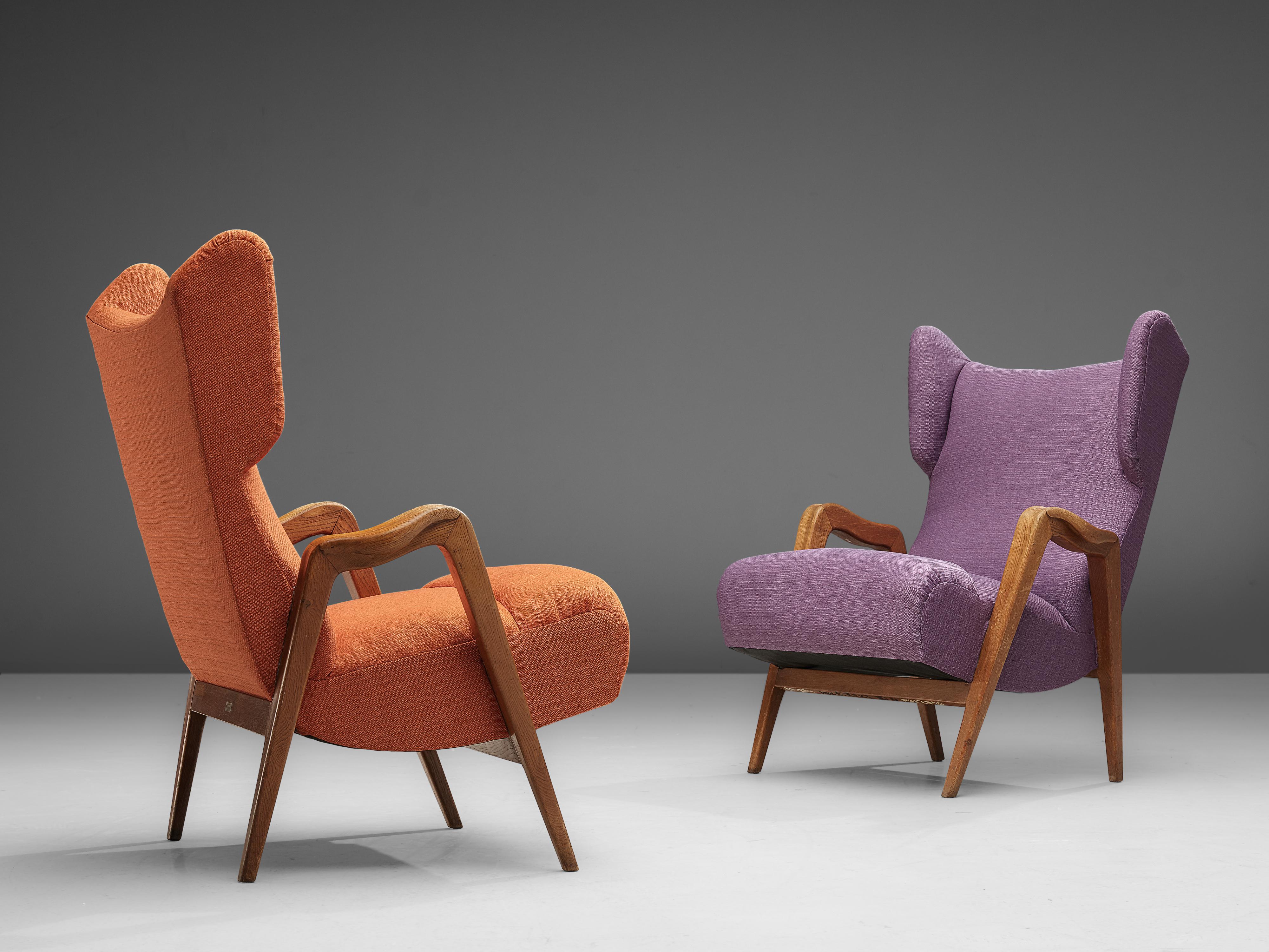 Pair of high wingback chairs, oak and orange and purple textured fabric, Czech Republic, 1950s

Sturdy and bulky set of wingback armchairs that features high backrests. The chairs are from late Art Deco period, as they show its distinctive