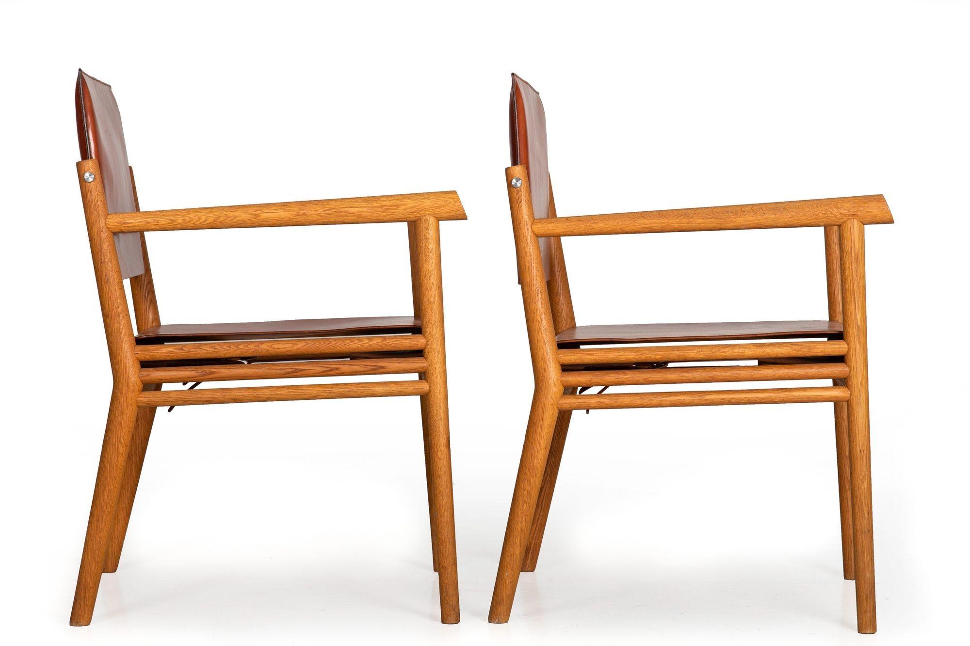 20th Century Pair of Wire-Brushed Oak and Leather Arm Chairs after Jean-Michel Frank For Sale