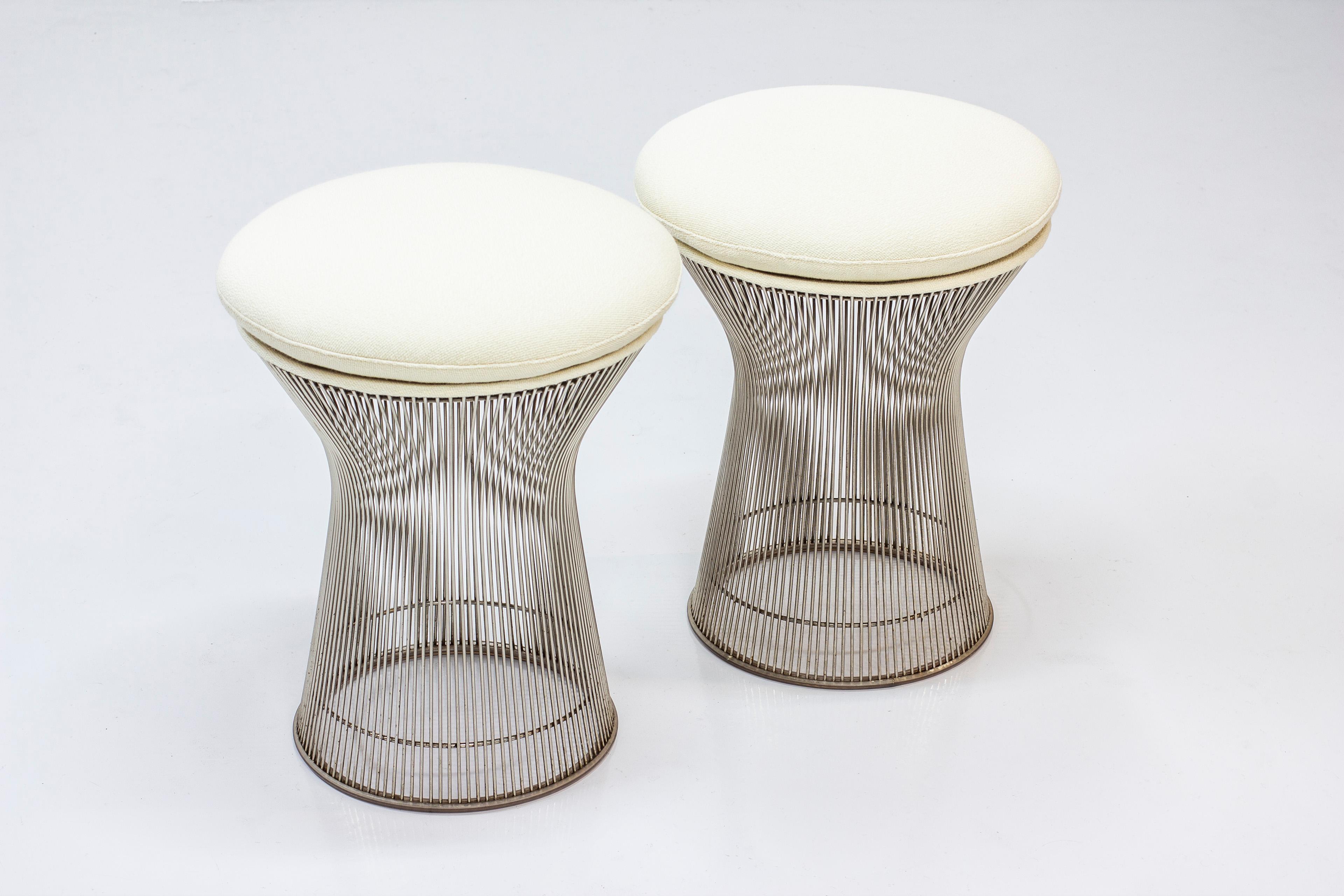 Pair of stools designed by Warren Platner. Designed in 1966 and produced by Knoll. Made from chromed steel bars, fiberglass, foam seats and new wool upholstery 