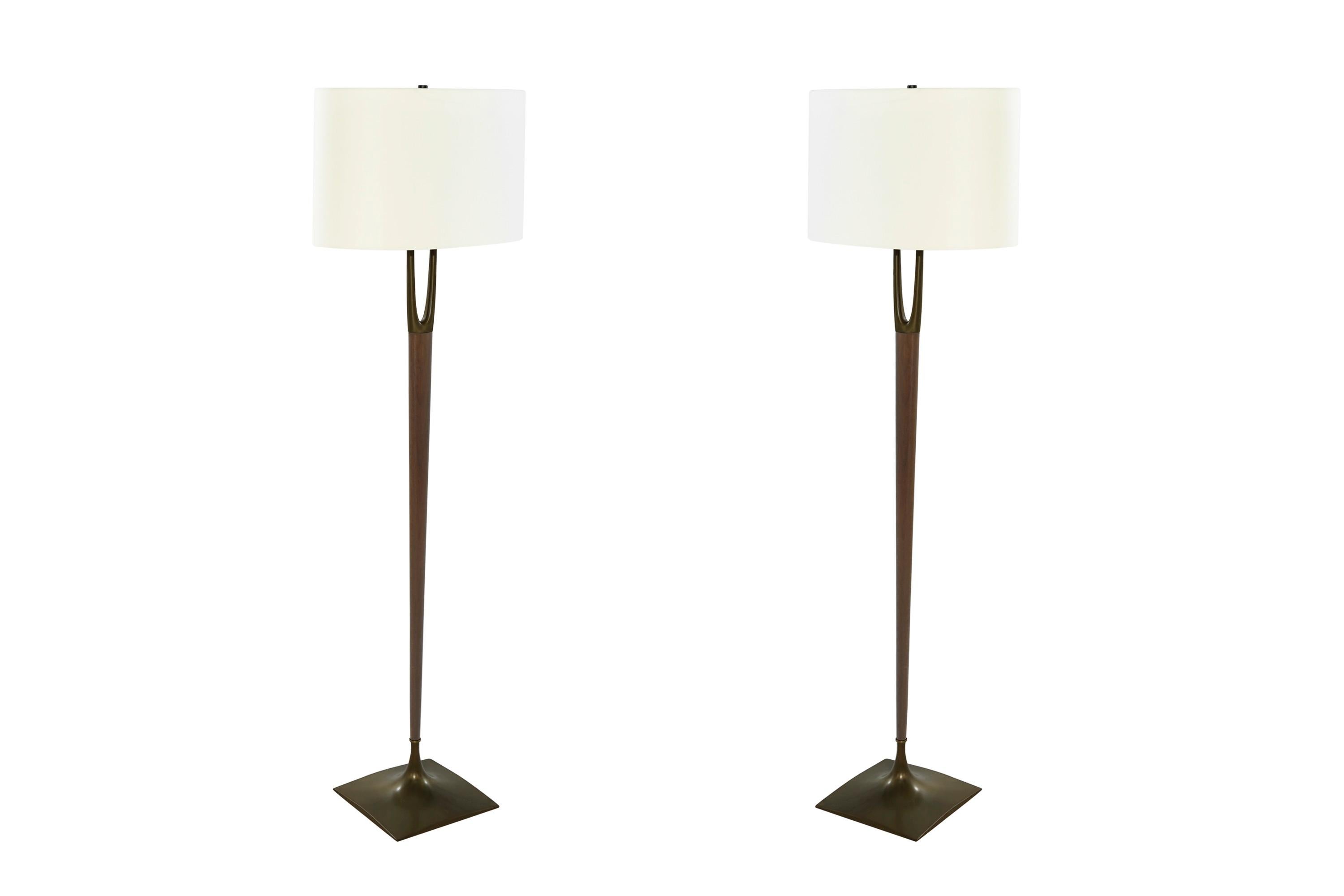 A historic set of floor lamps designed by Harold Weiss & Richard Barr, manufactured by Laurel Lamp Co., in the 1960s. 

Walnut fully restored to match their original natural walnut finish, formerly brass plated stand and top updated in bronze with