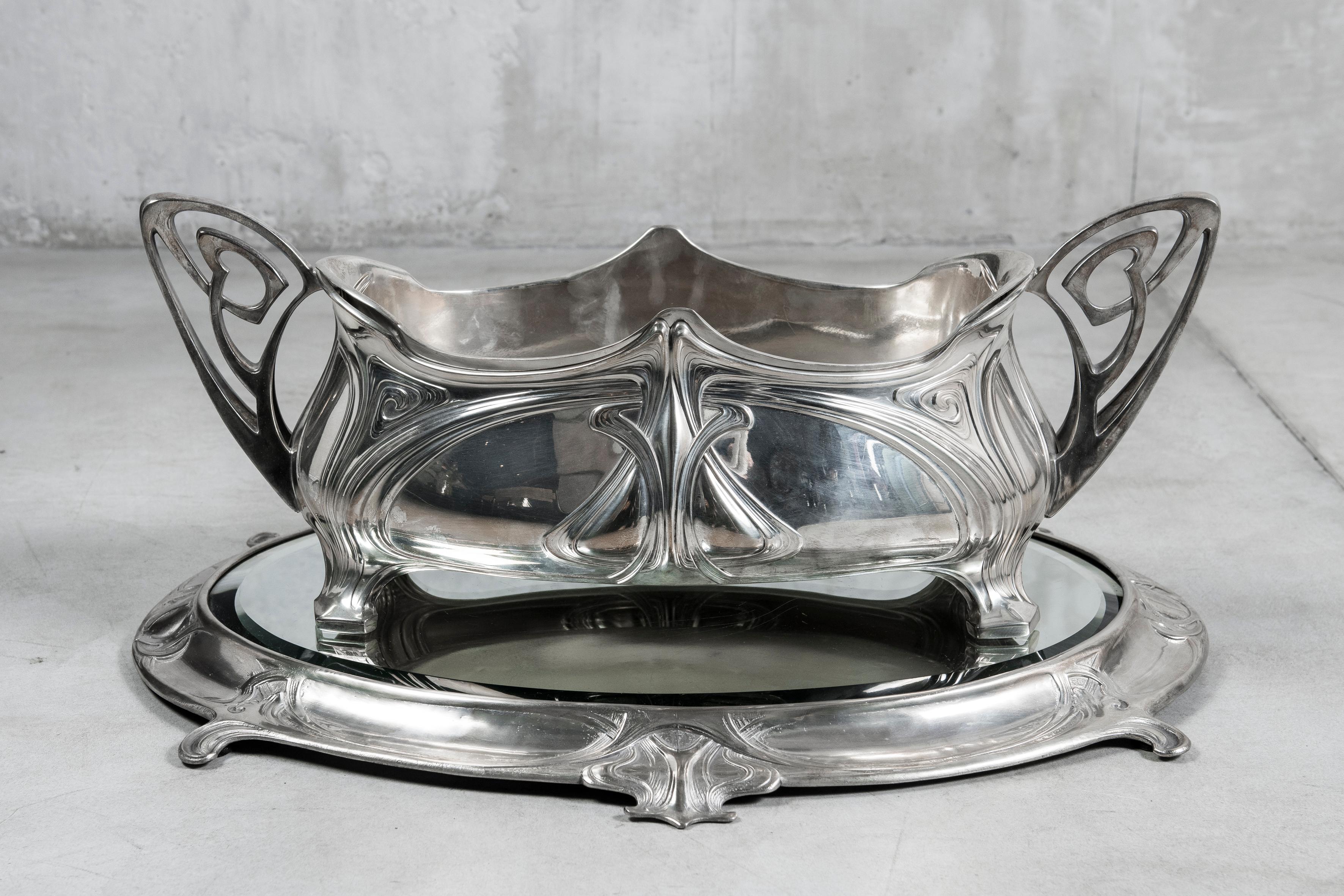 Pair of W.M.F. silver plate jardiniere with mirror plateau. Jugendstil style, Germany, circa 1900.