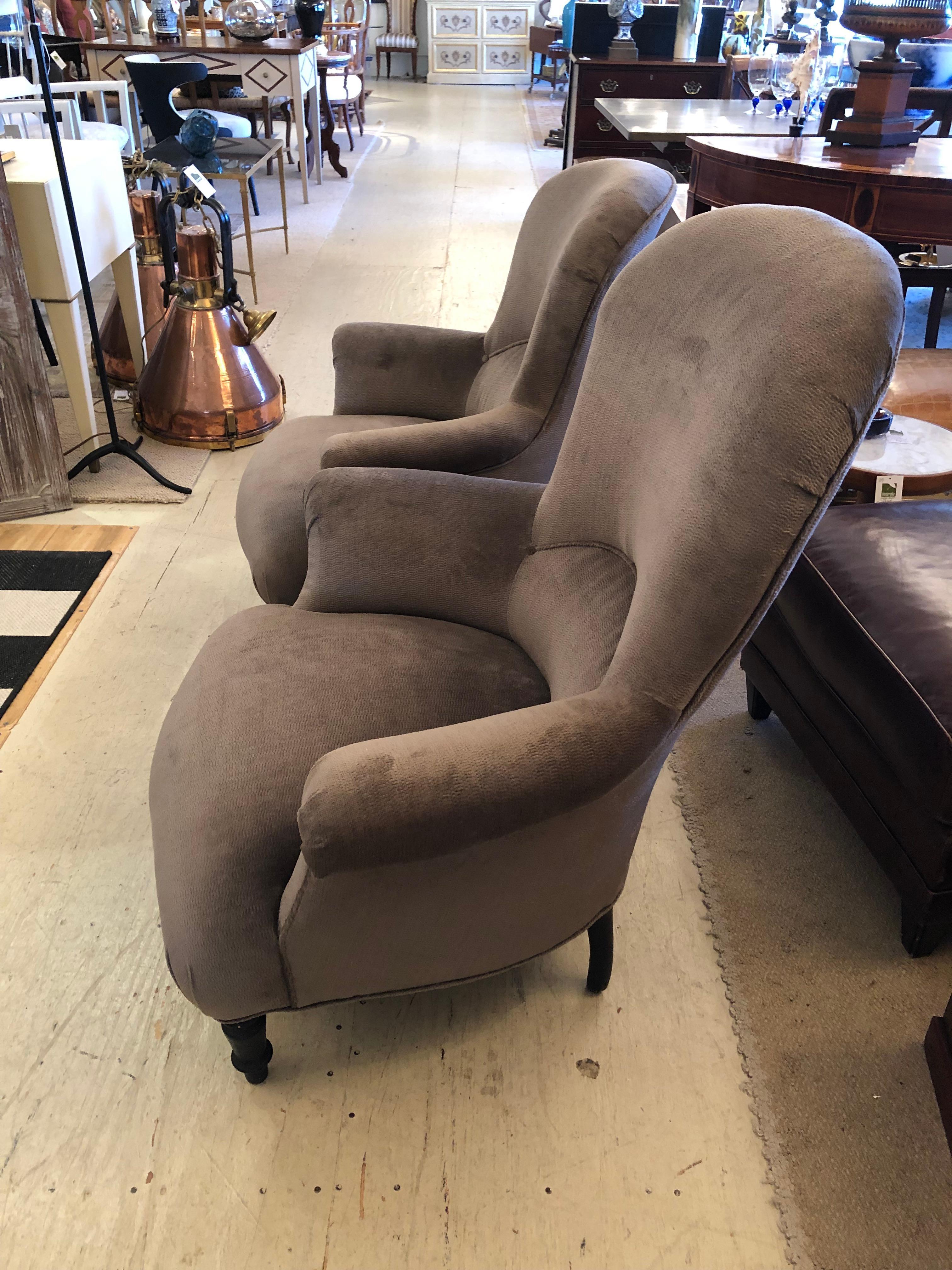 Wonderfully shaped mid 19th century French club chairs, beautifully upholstered in a soft mushroom color velvet chenille. We call them Mr. and Ms chairs., as one is slightly shorter and smaller than the other.
Slightly smaller 