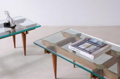 Pair of wood and brass coffee tables with thick glass tops. Italian manufacture